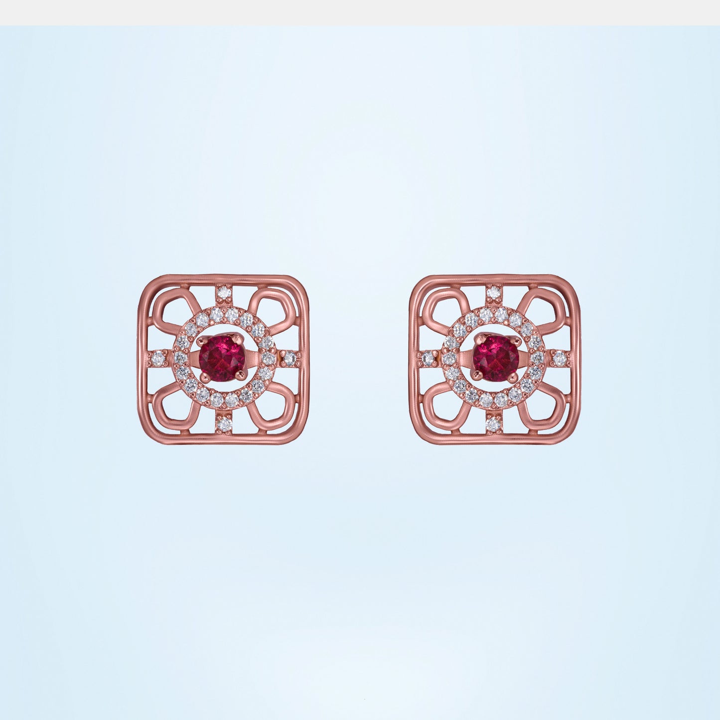 ruby earrings set in rose gold