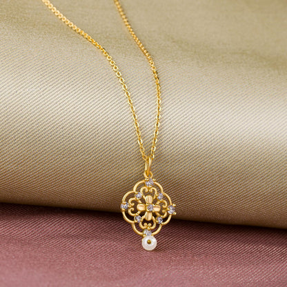 Golden Necklace with a Flower Design on it