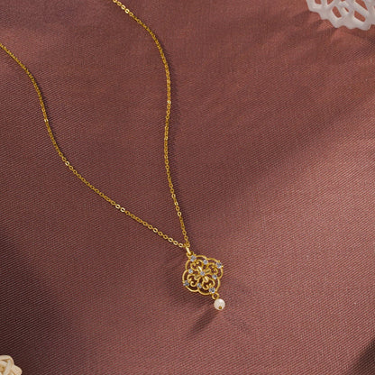 Golden Necklace with a Flower Design on it