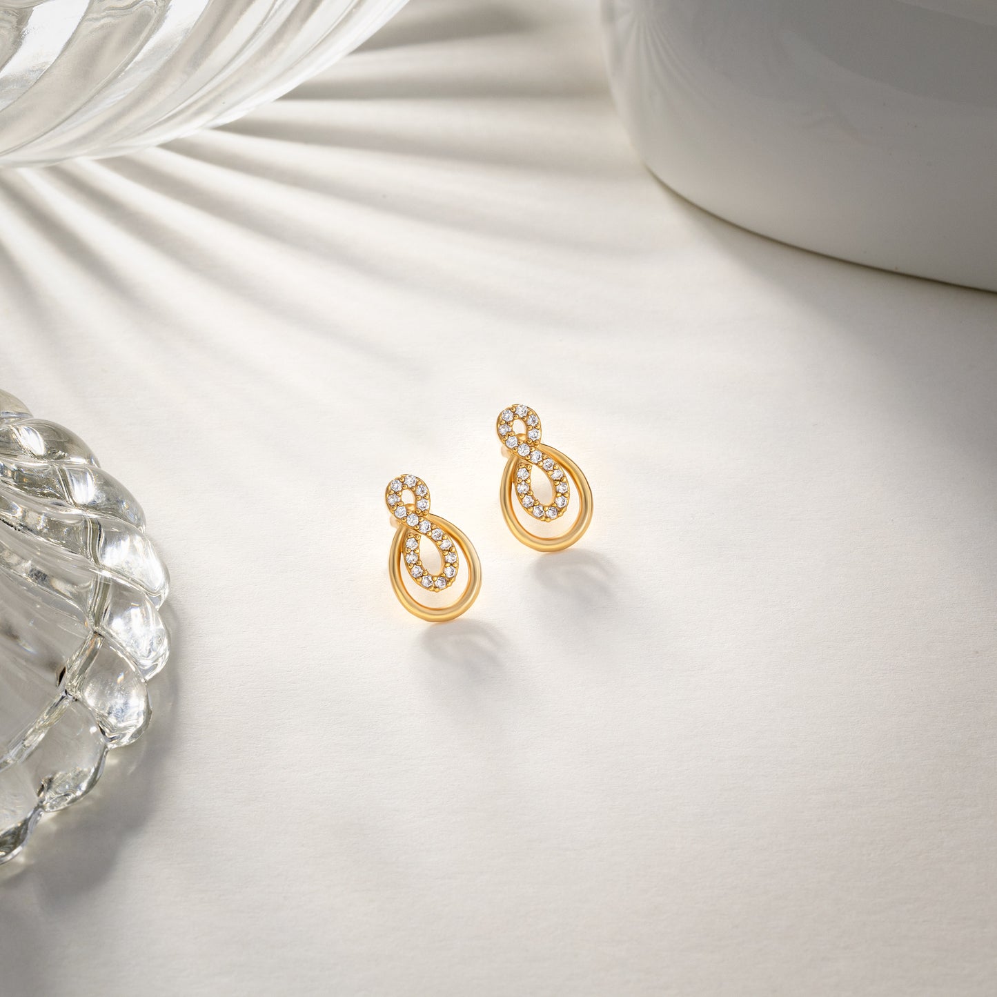 pair of golden earrings with diamonds