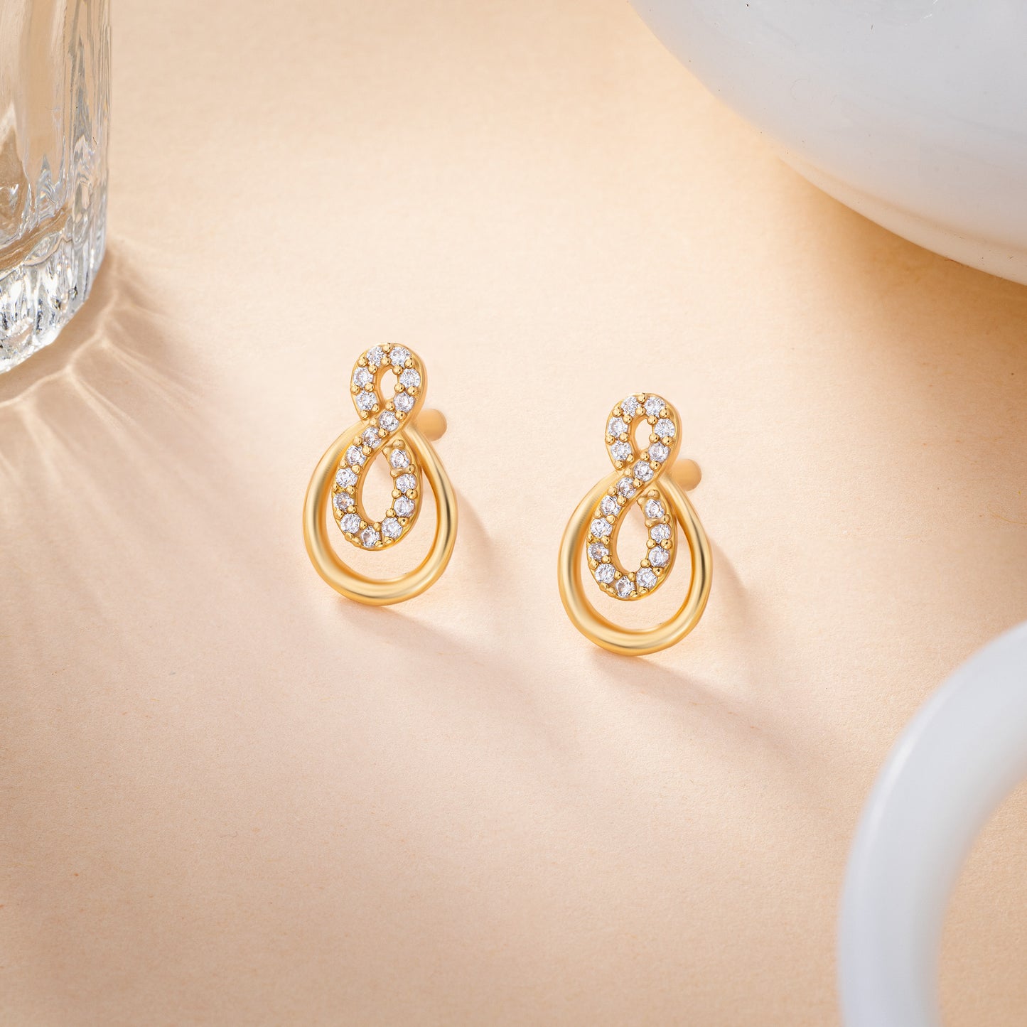 pair of golden earrings with diamonds