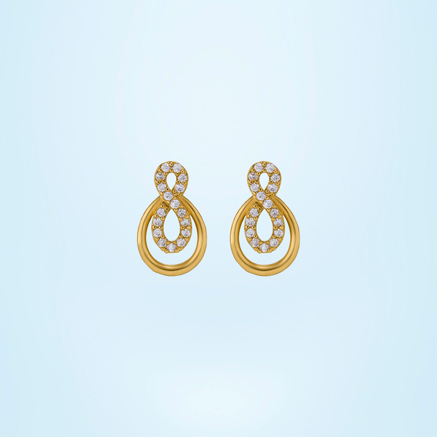 pair of golden earrings with diamonds