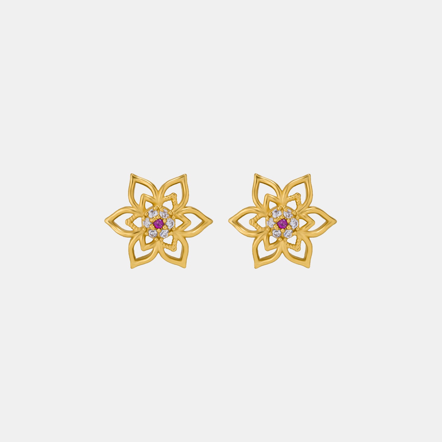 pair of golden earrings with a flower design