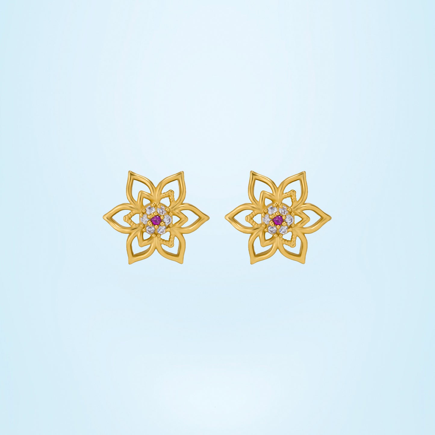 pair of golden earrings with a flower design