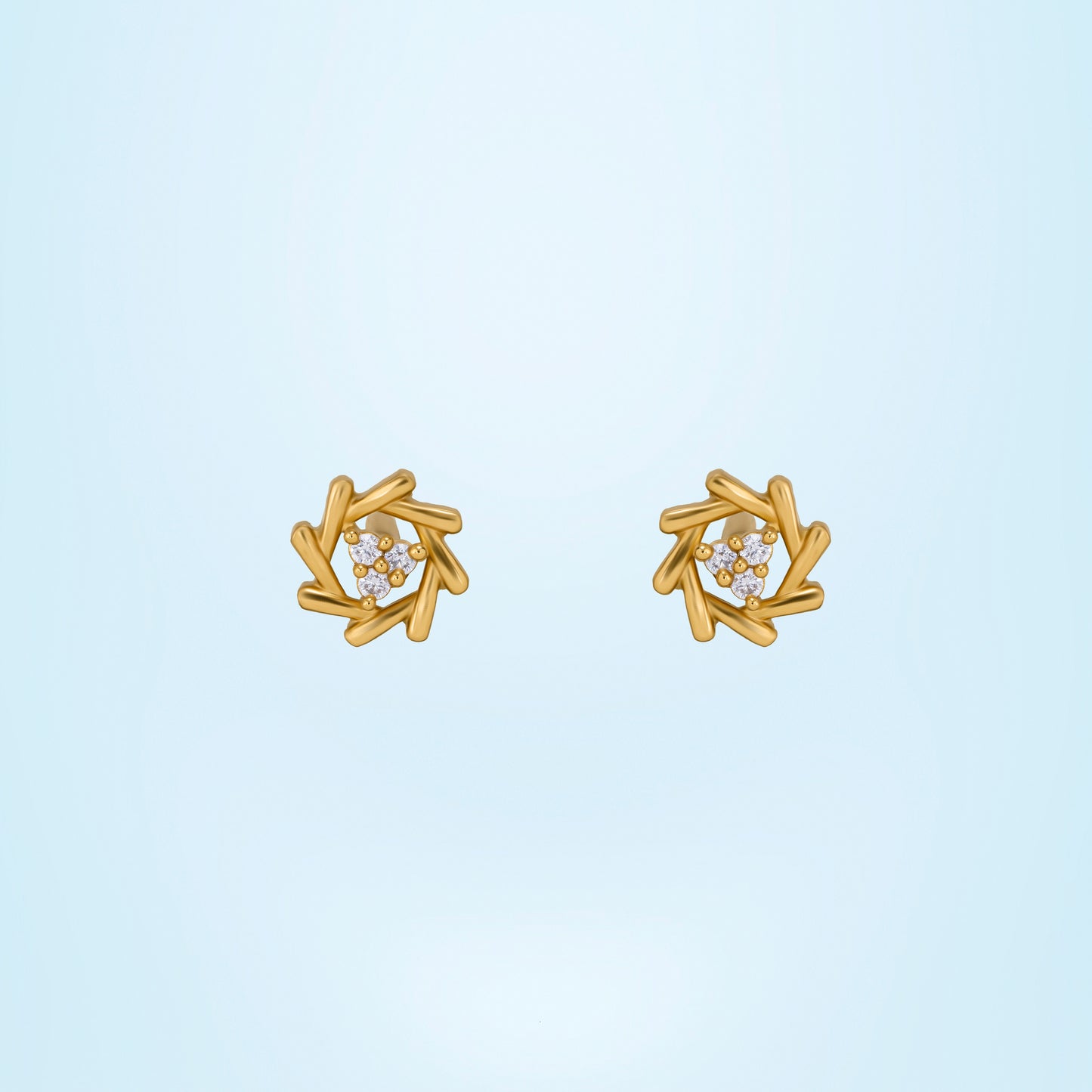 pair of golden earrings with a diamond