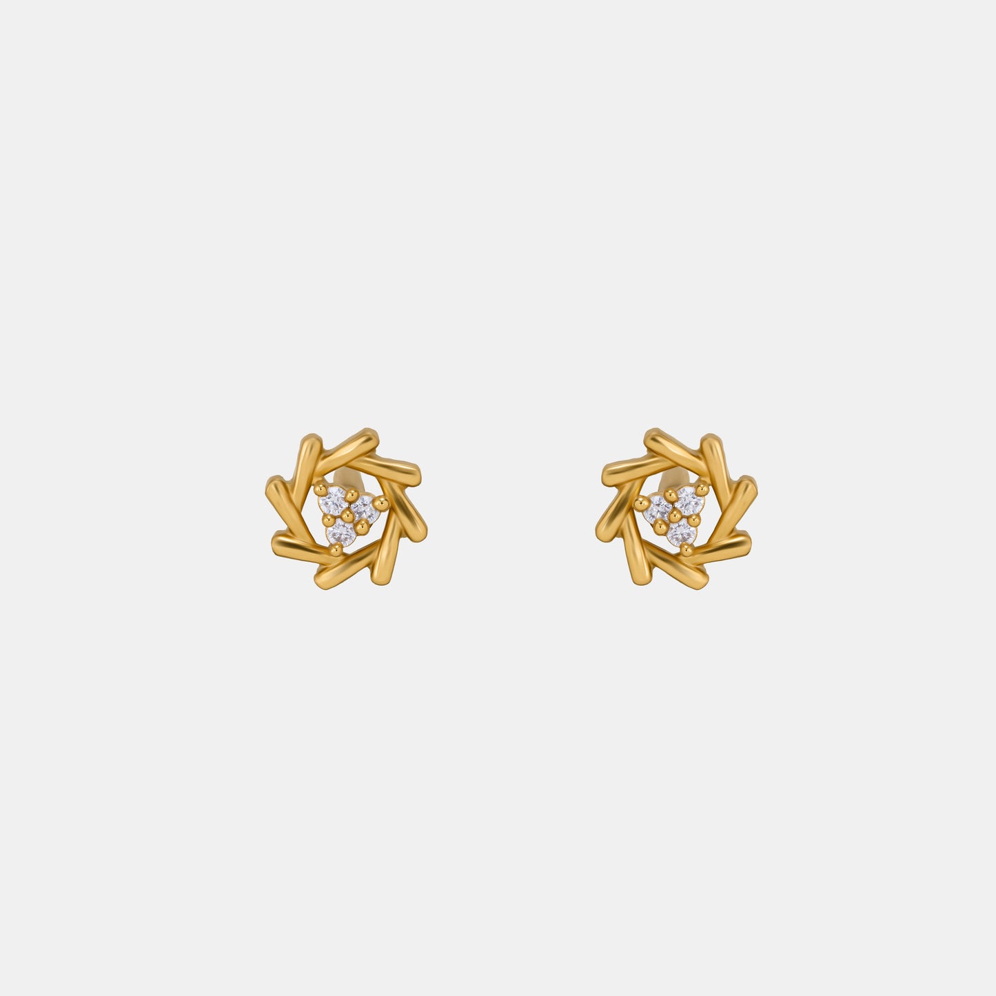 pair of golden earrings with a diamond