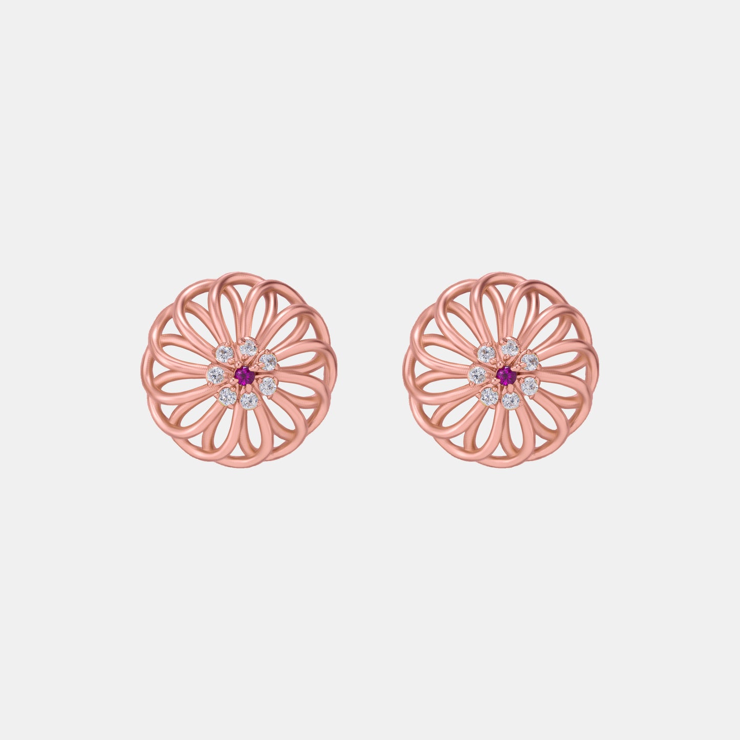 pair of rose gold earrings with diamonds and ruby