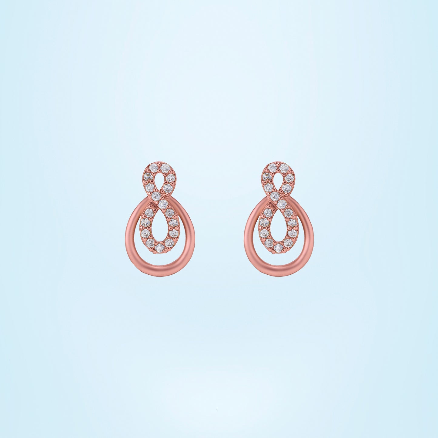 pair of rose gold earrings with diamonds