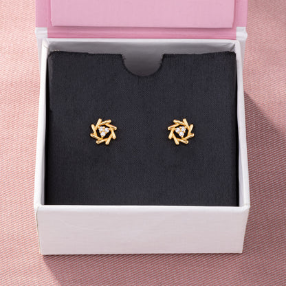 Pair of Golden Earrings with a Diamond