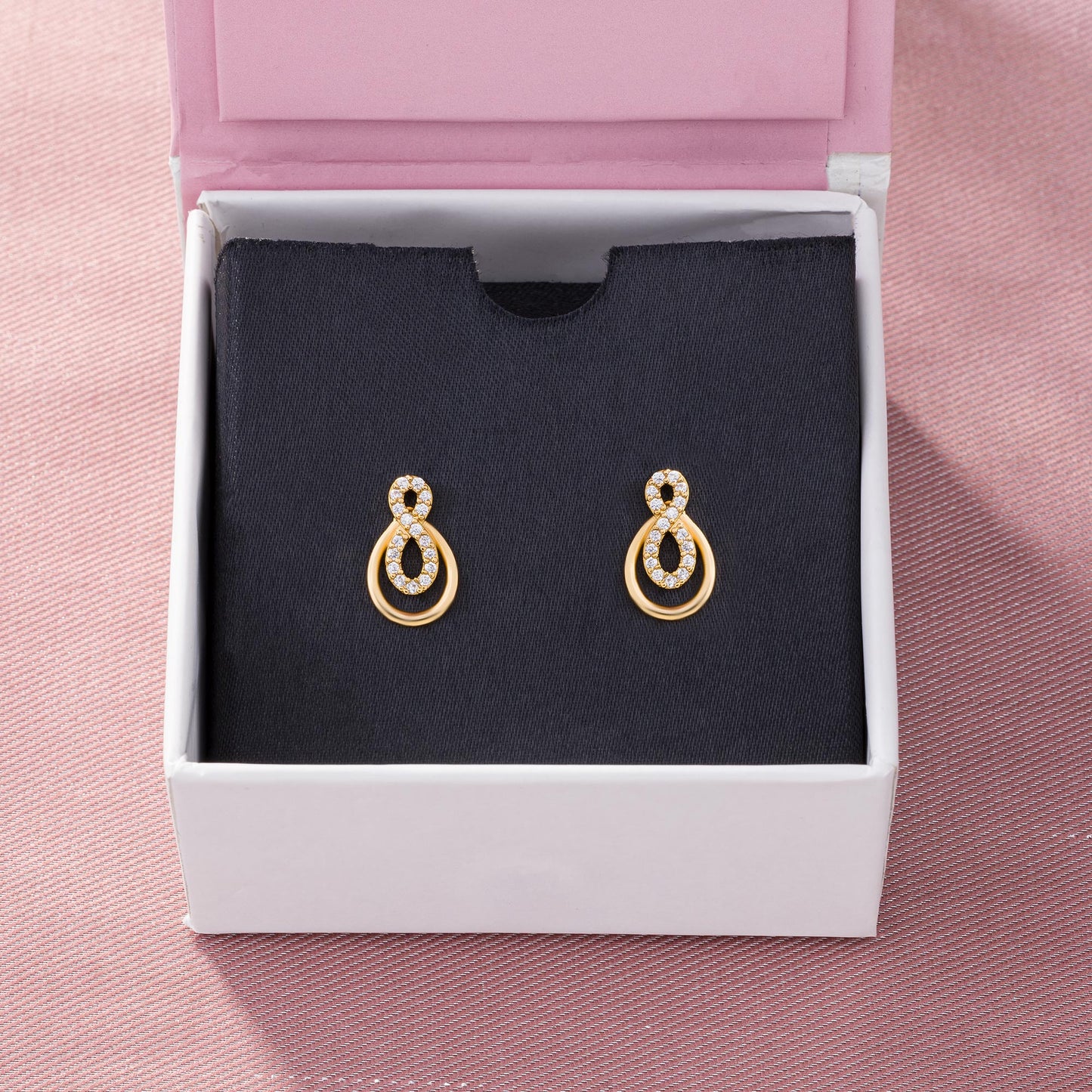 pair of golden earrings with diamonds