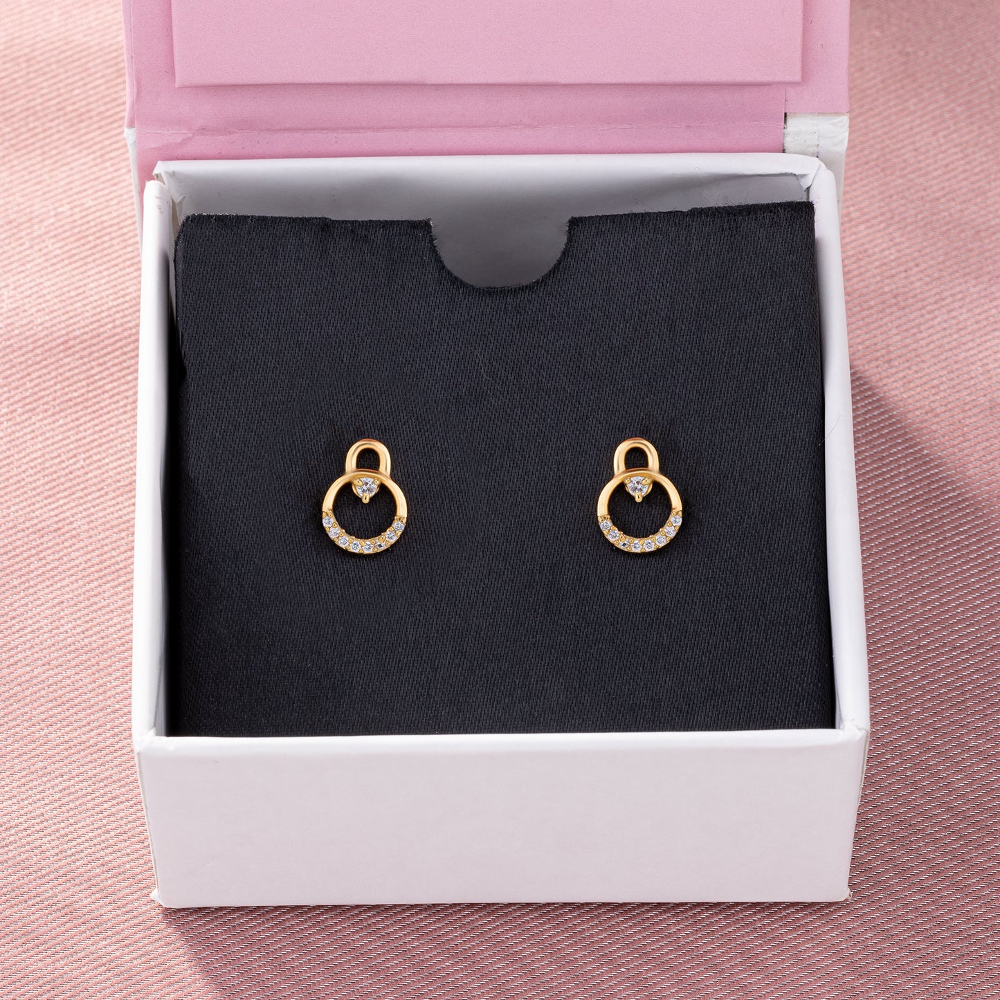 pair of golden earrings with diamonds