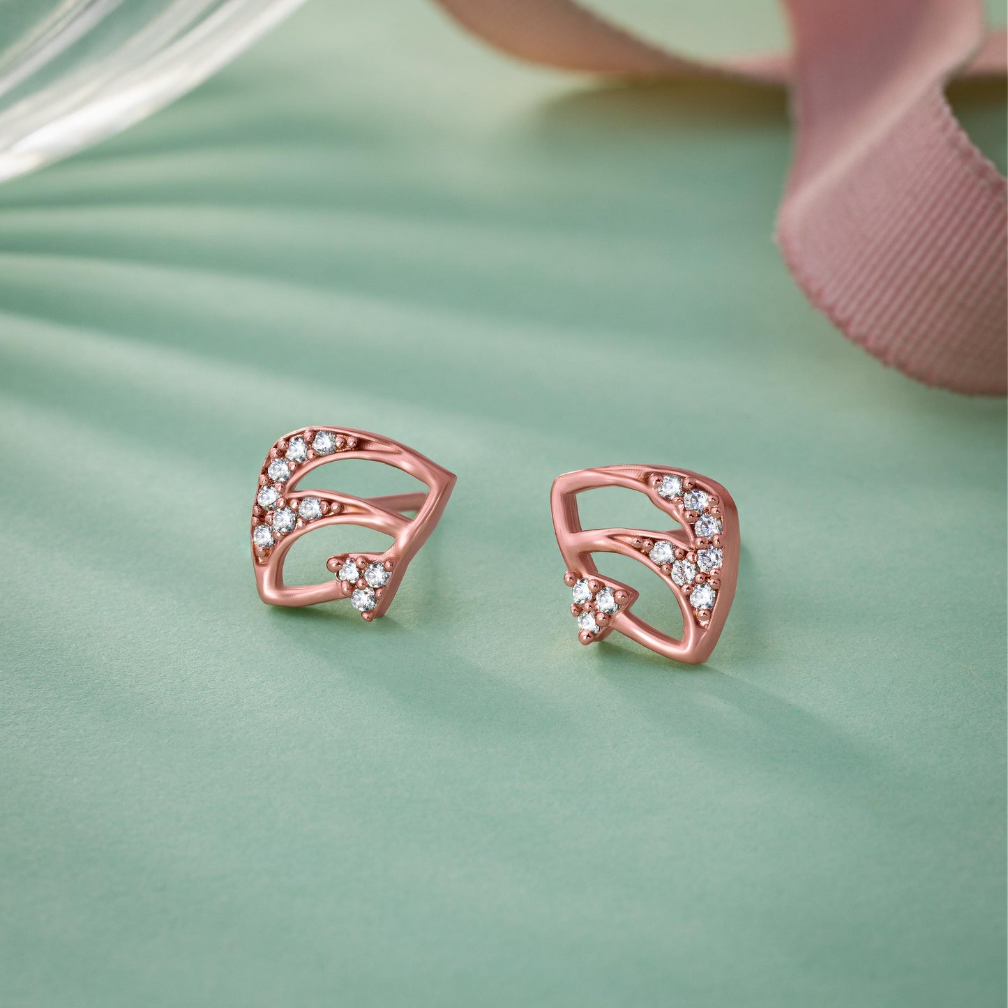 pair of elegant rose gold earrings adorned with sparkling diamonds