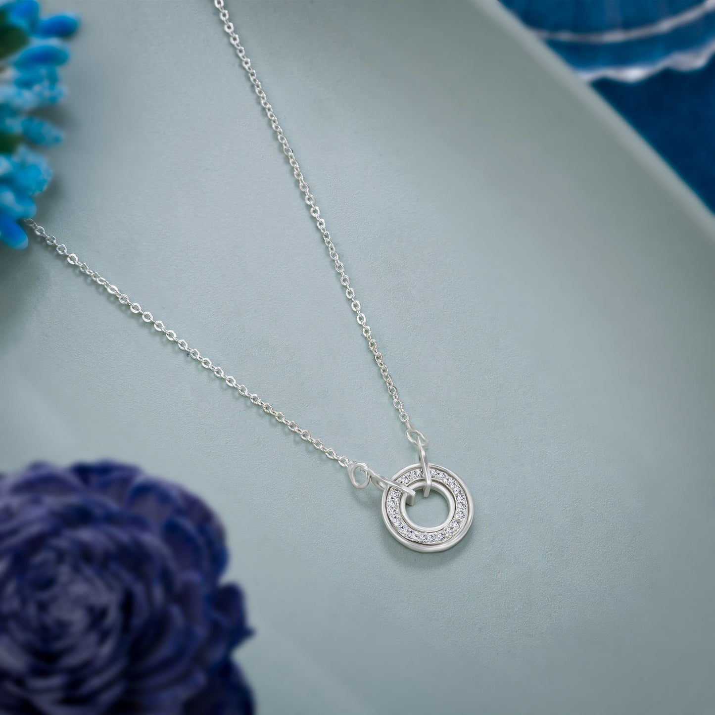 silver necklace with a diamond circle