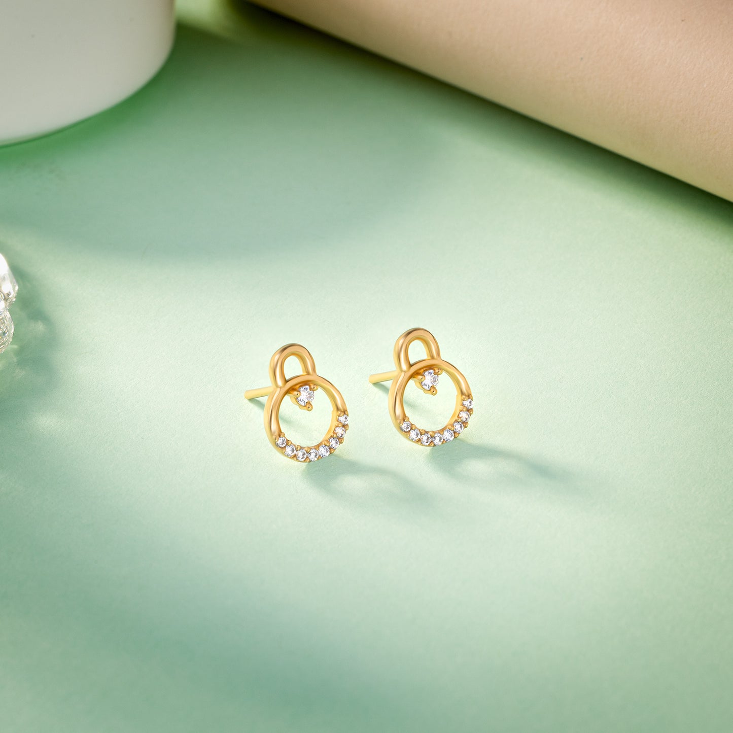 pair of golden earrings with diamonds