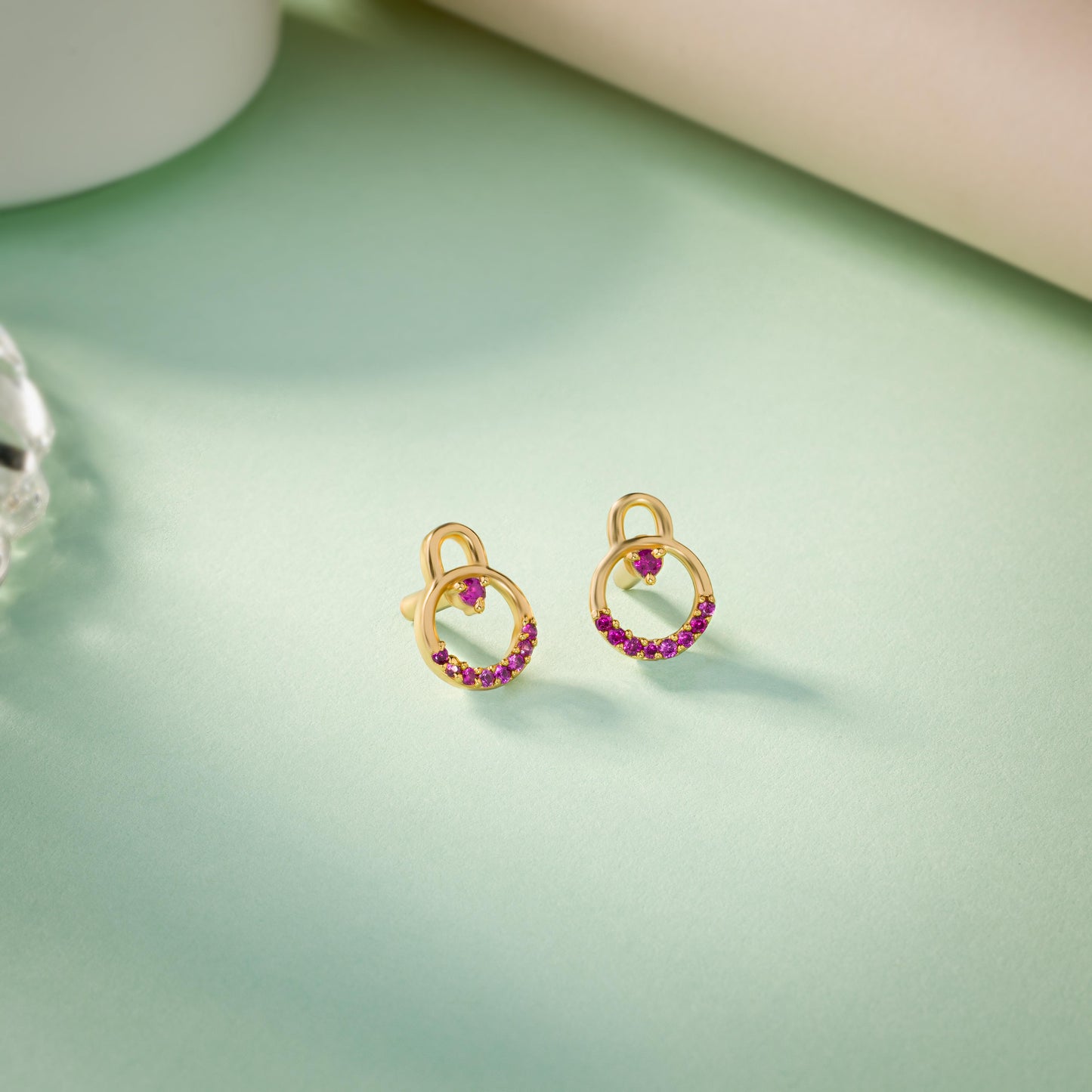 pair of golden earrings with diamonds