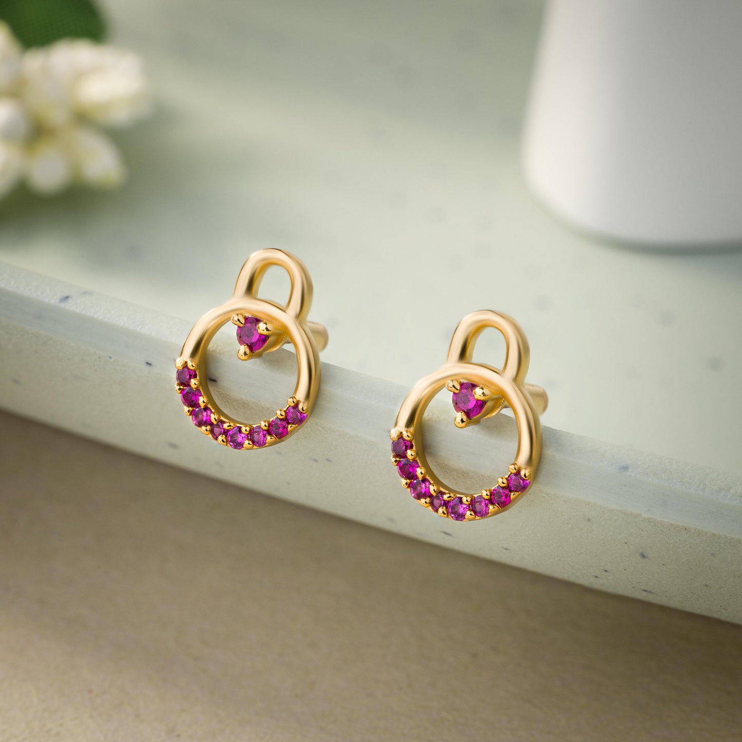 pair of golden earrings with diamonds