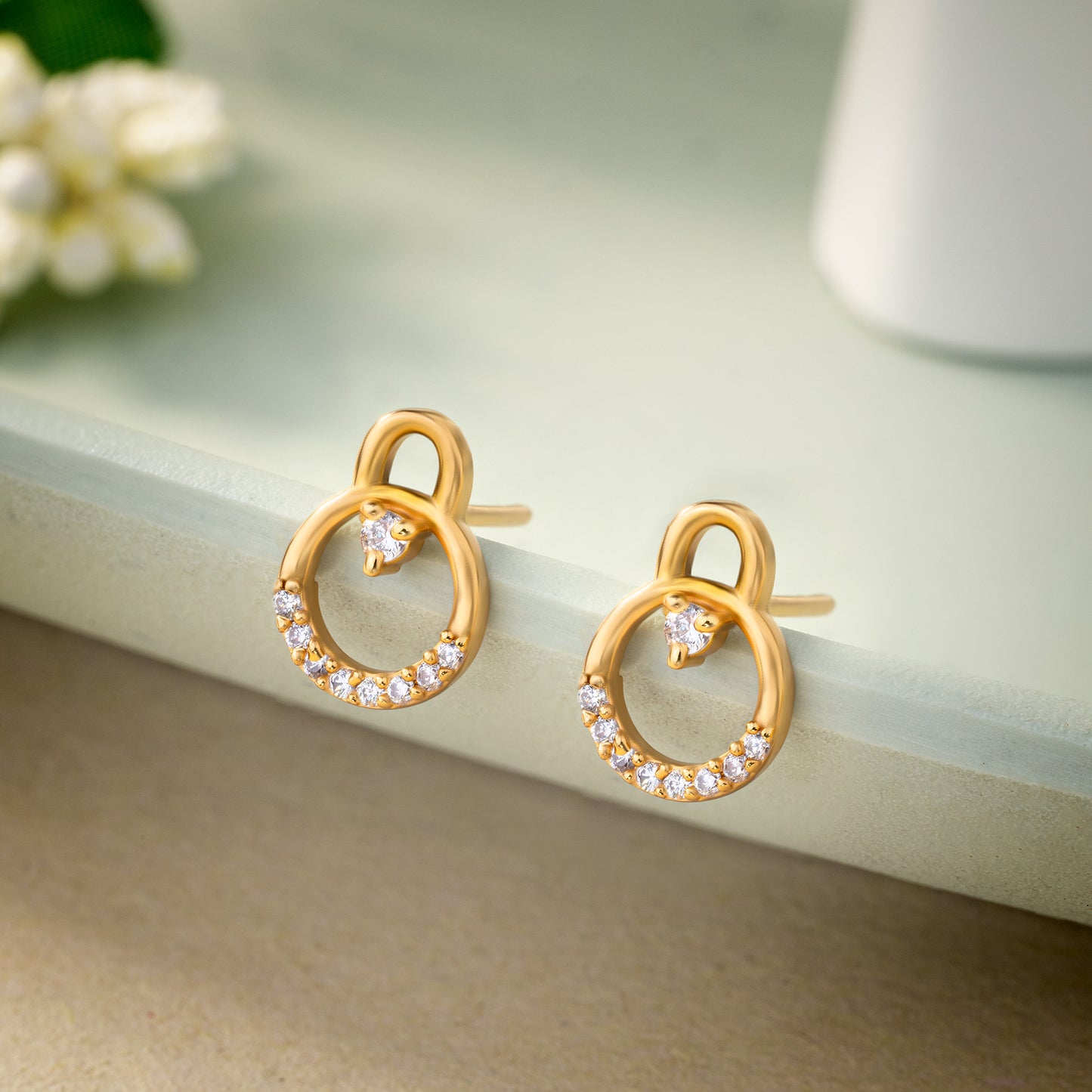 pair of golden earrings with diamonds