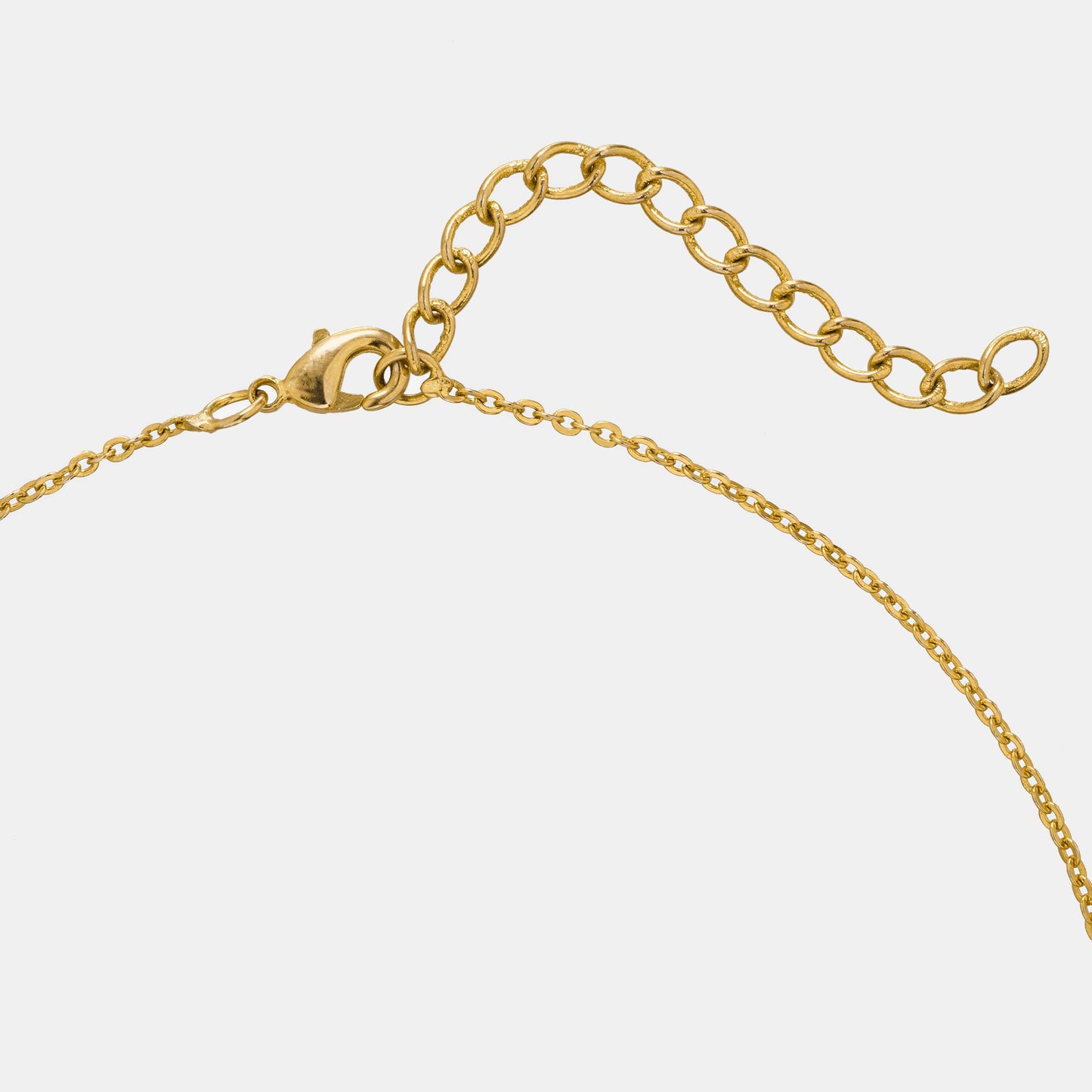 golden necklace with a diamond pendant