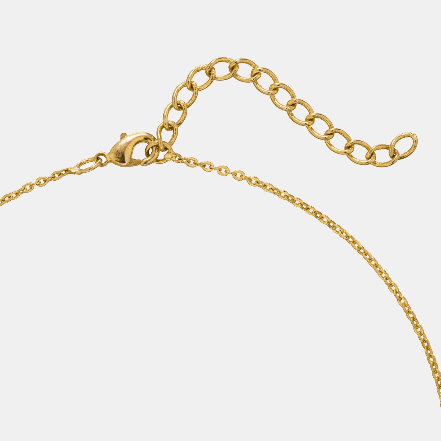 golden necklace with a diamond heart pendant