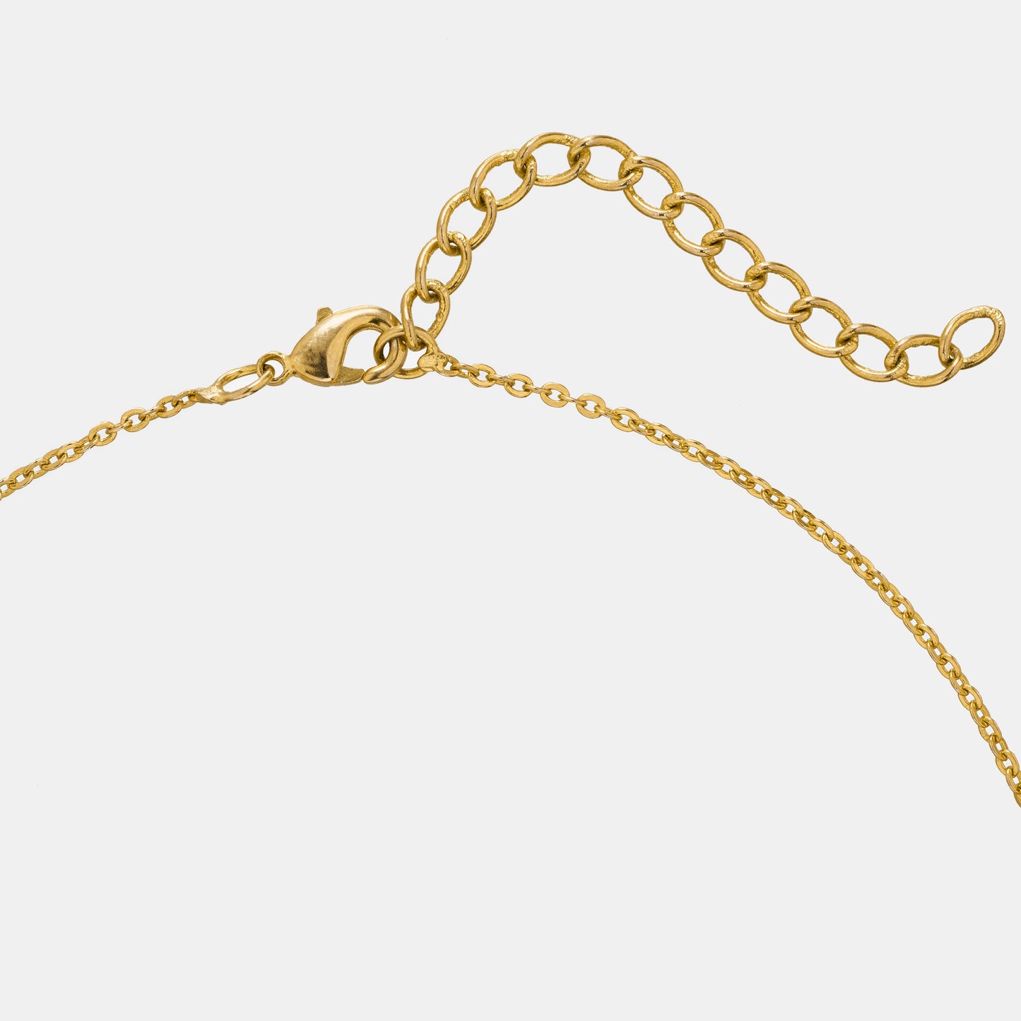 golden necklace with a diamond heart pendant