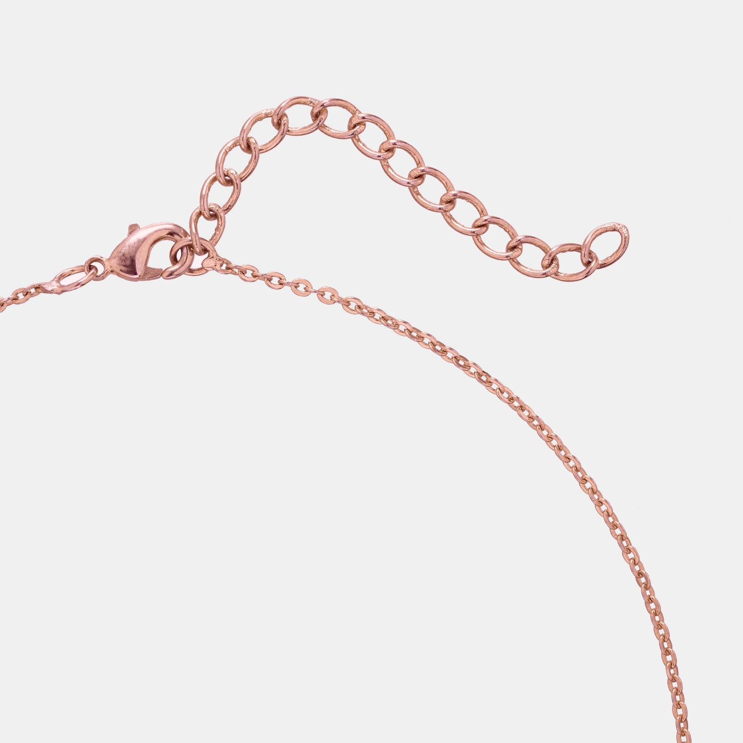 rose gold necklace with a pink diamond leaf pendant