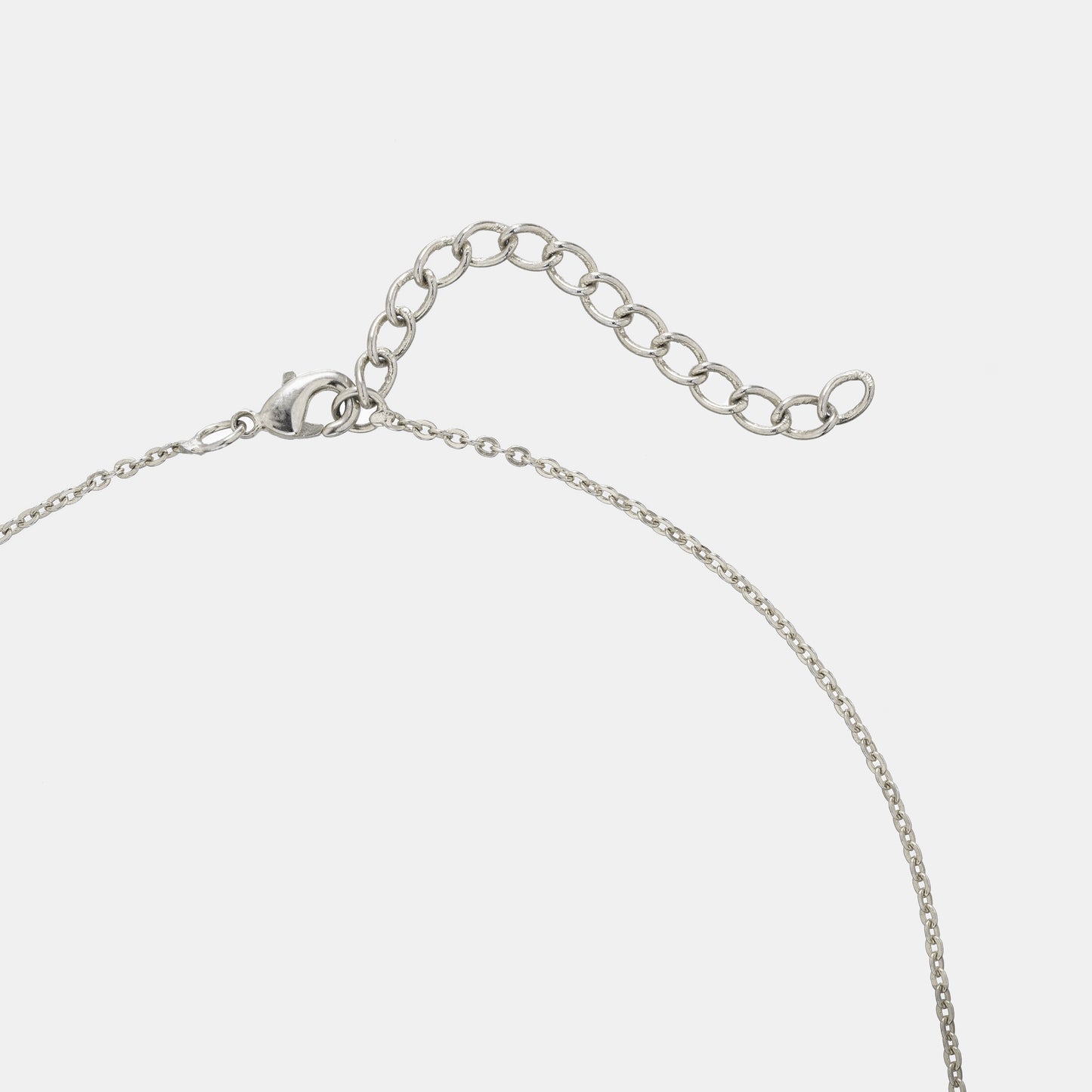 silver necklace with a stone and a chain