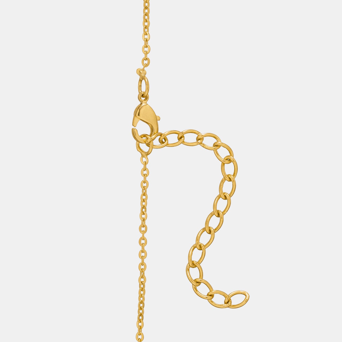 golden necklace with a small arrow on it