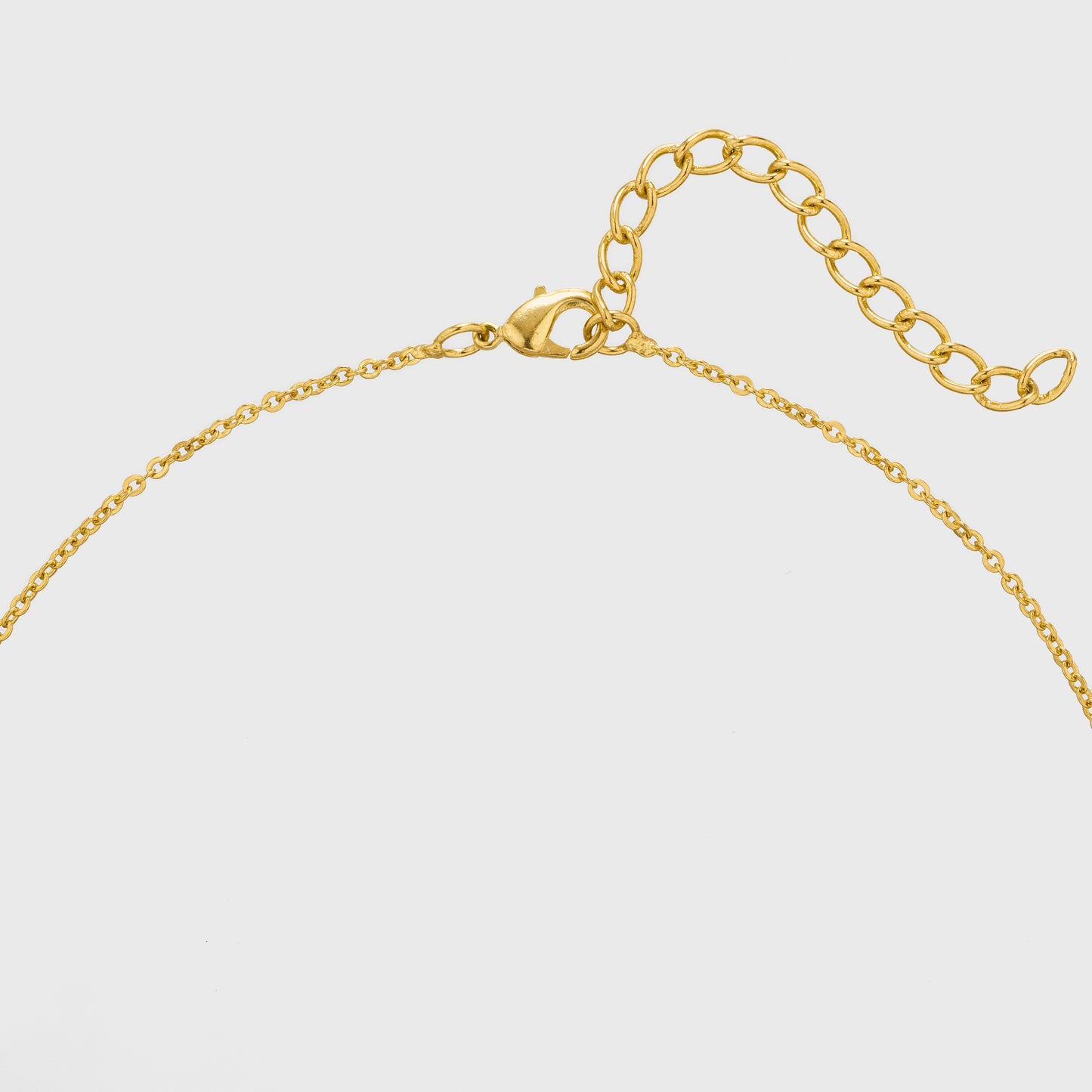 golden necklace with a small diamond on the front