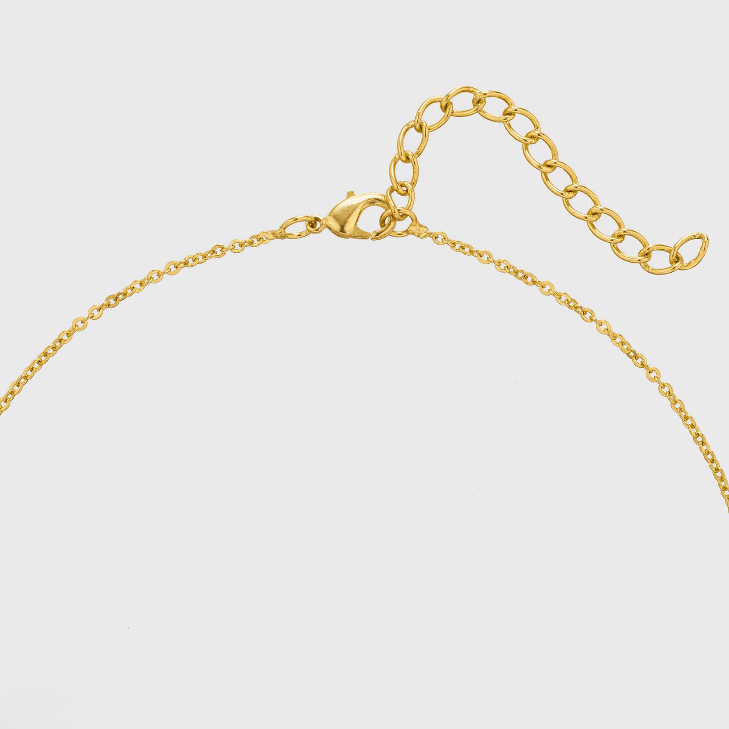 golden necklace with a diamond pendant