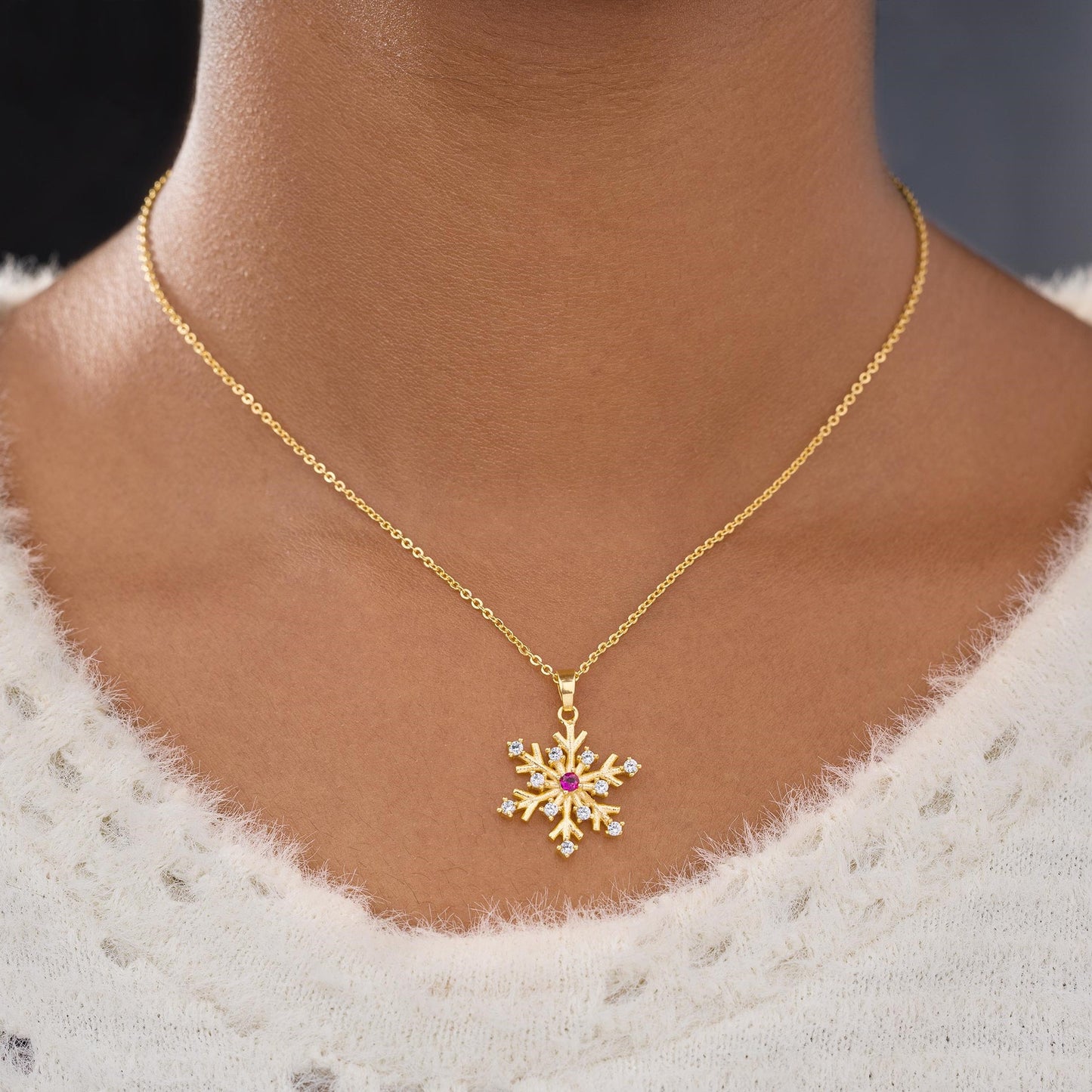 golden necklace with a flower charm