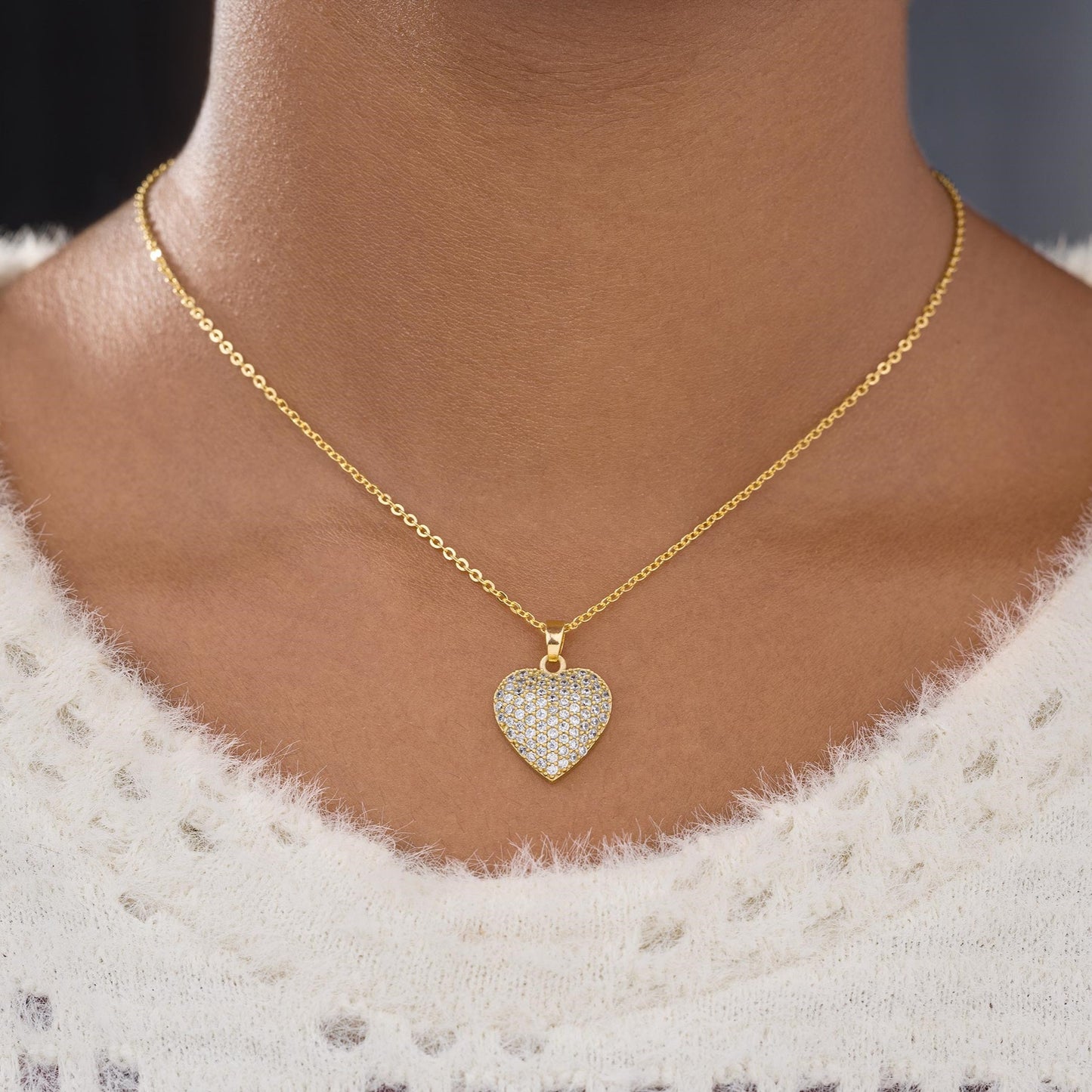 golden necklace with a heart pendant