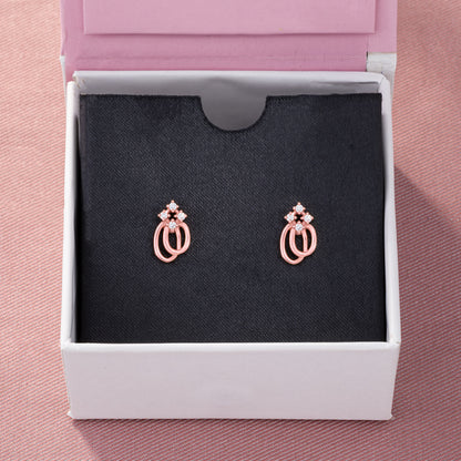 Pair of Rose Gold Earrings with a Diamond