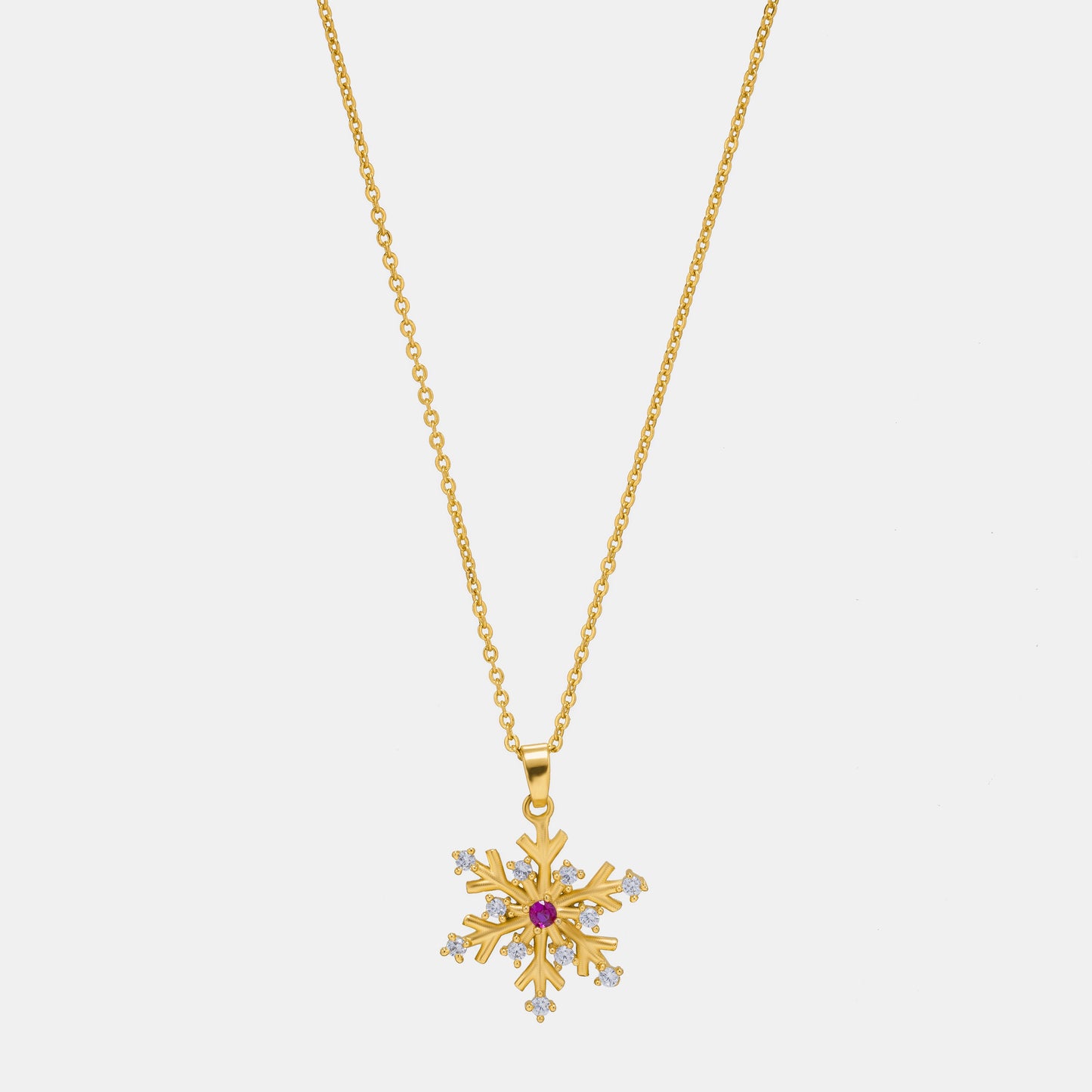 golden necklace with a flower charm