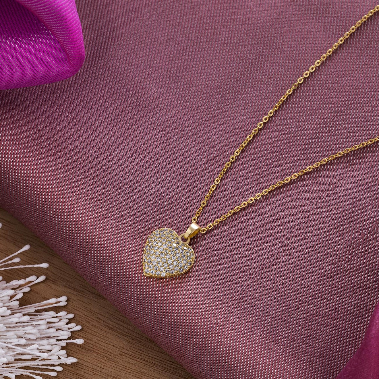 golden necklace with a heart pendant