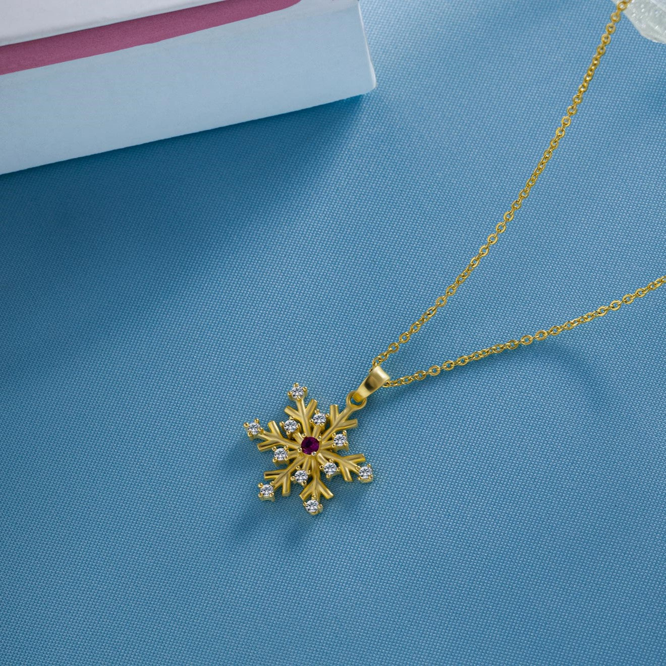 golden necklace with a flower charm