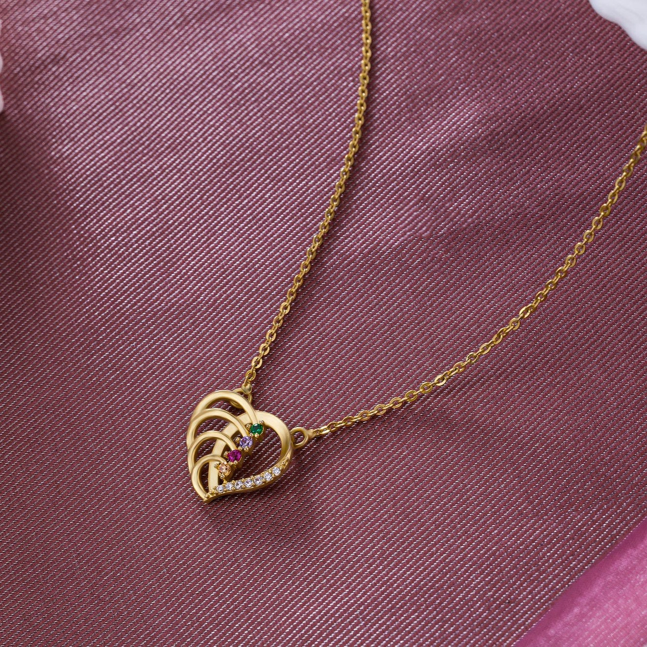 golden necklace with a diamond heart pendant