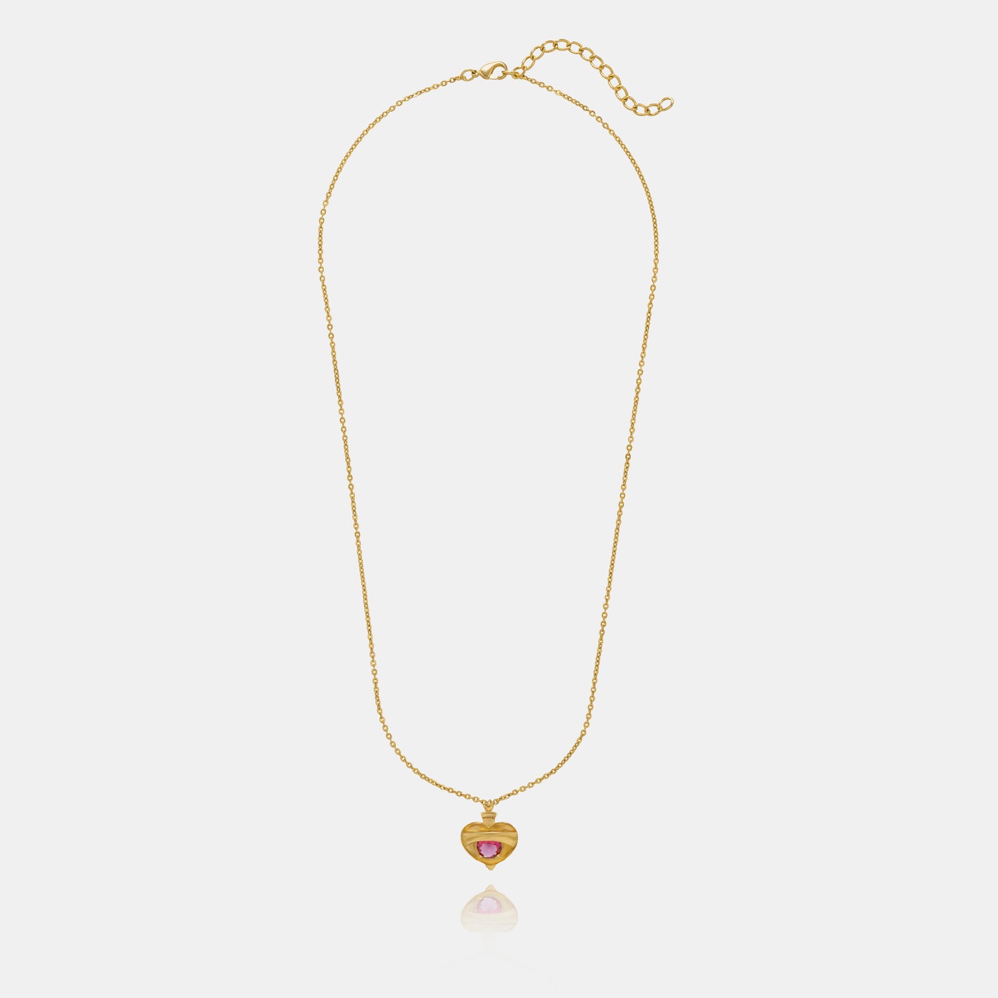 golden necklace with a heart shaped pendant