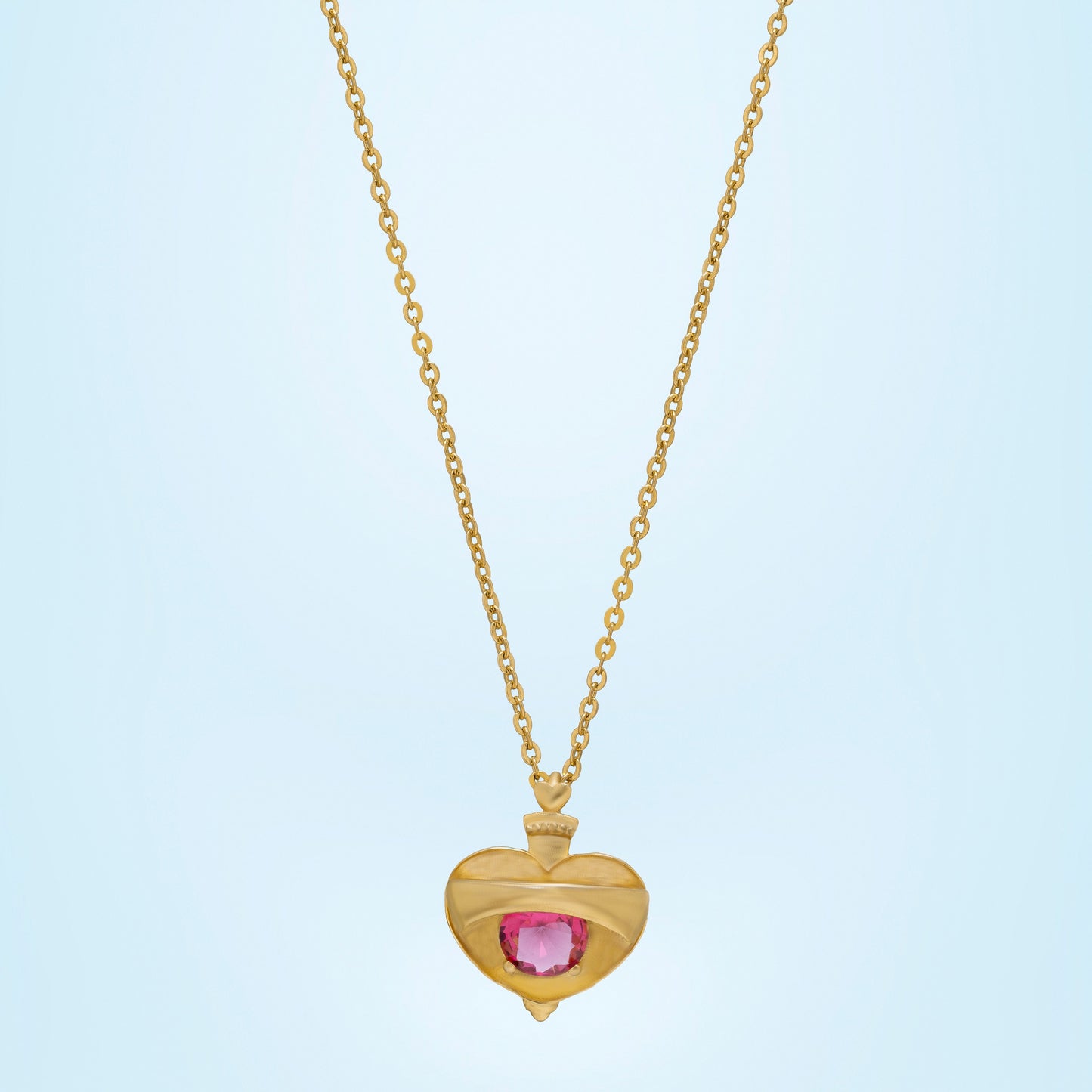 golden necklace with a heart shaped pendant