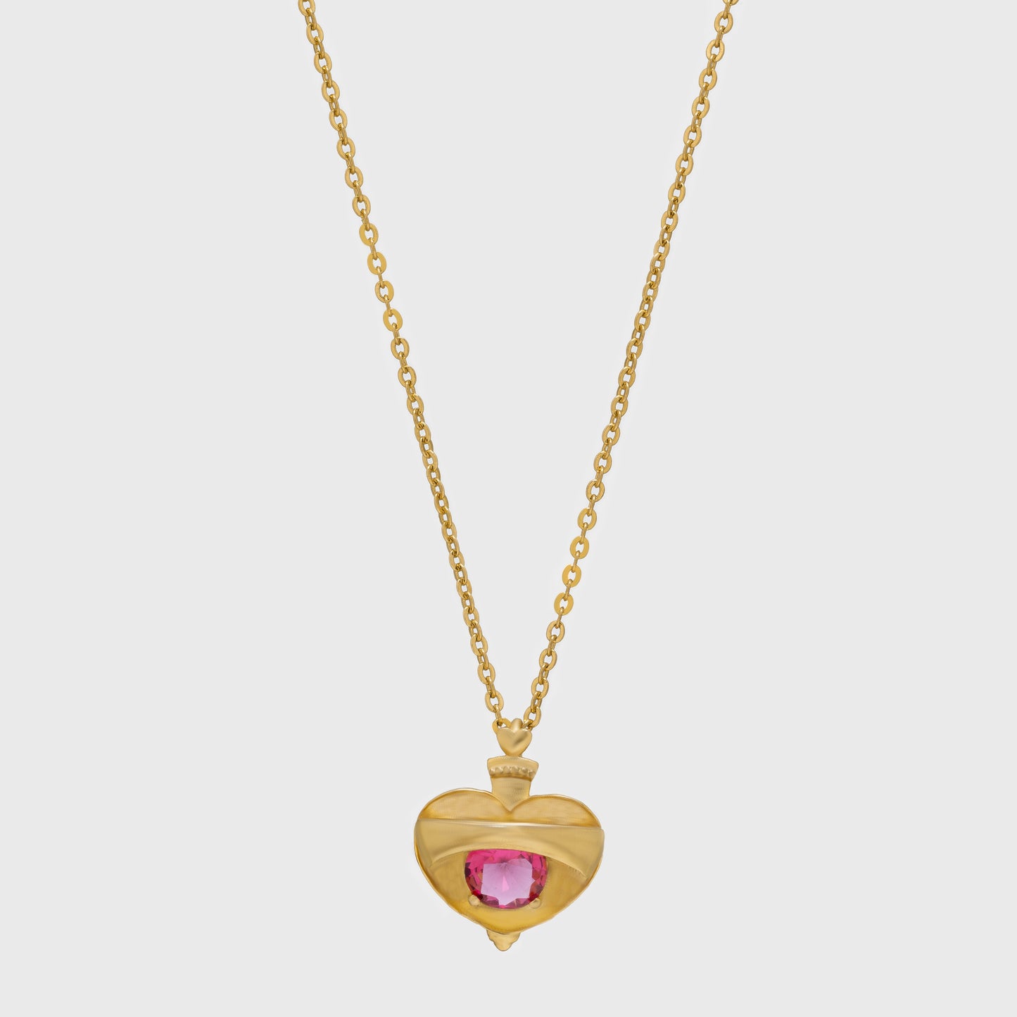 golden necklace with a heart shaped pendant