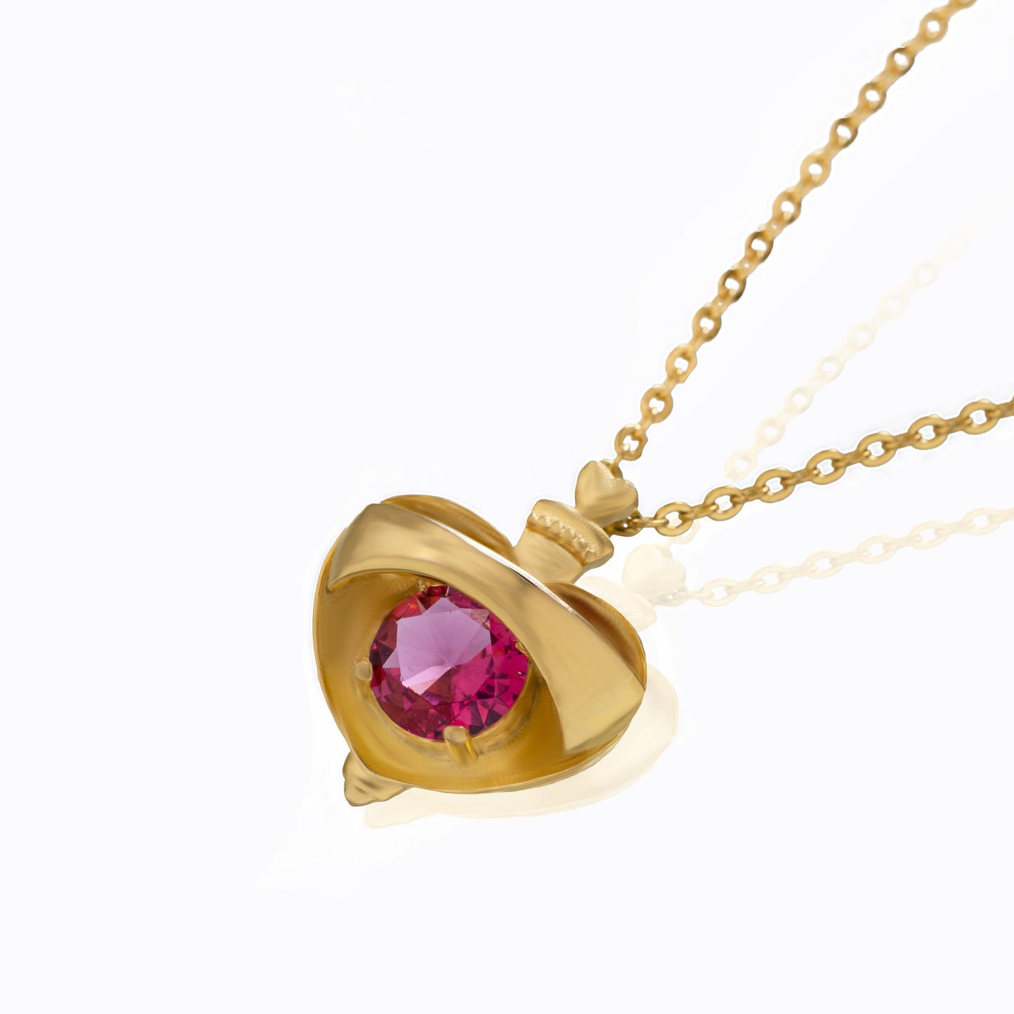 golden necklace with a heart shaped pendant