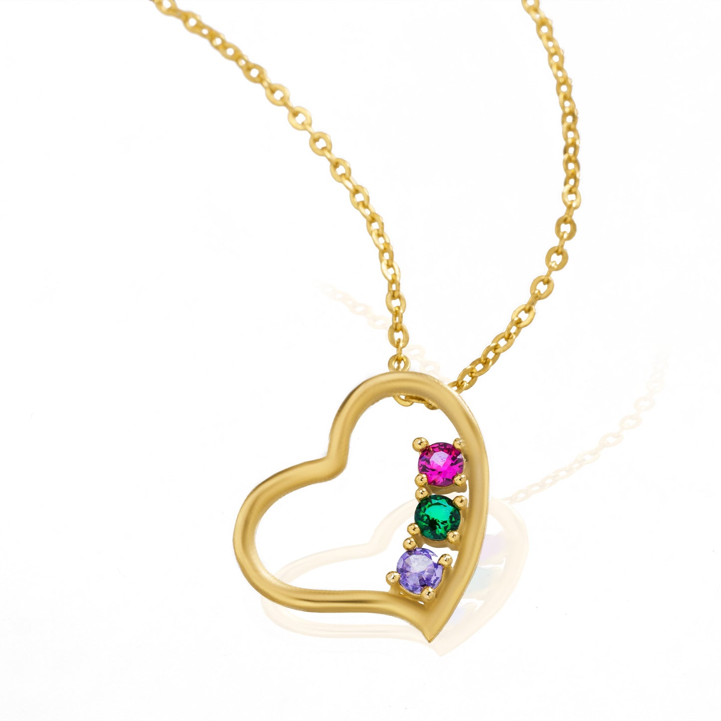 golden necklace with a heart pendant and a rainbow stone