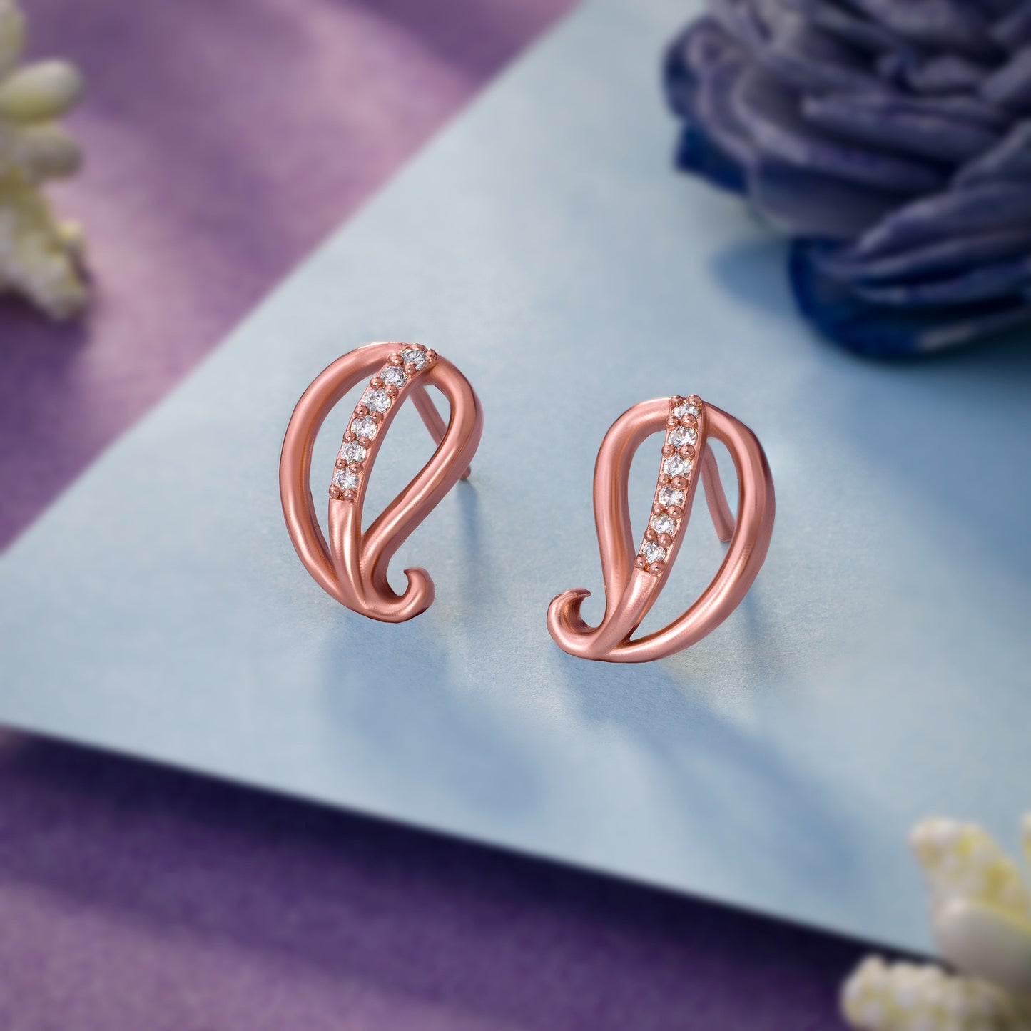 rose gold earrings with sparkling diamonds