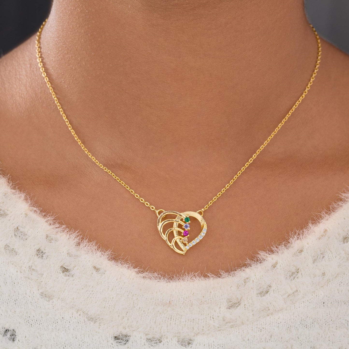 golden necklace with a diamond heart pendant