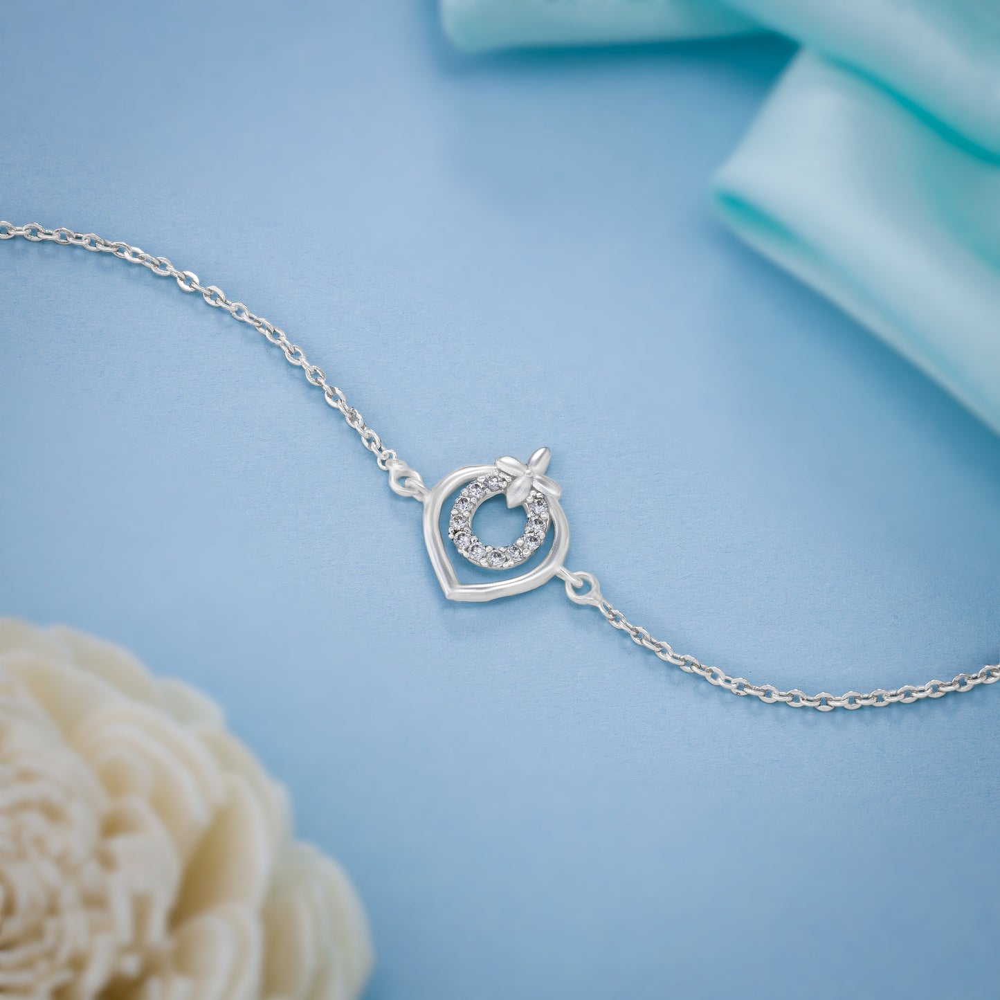 silver bracelet with a heart charm