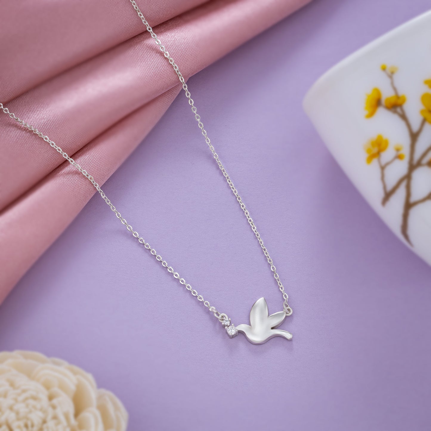 new heights with this enchanting silver bird necklace