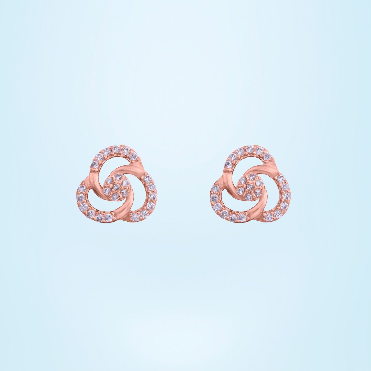 pair of rose gold and diamond earrings