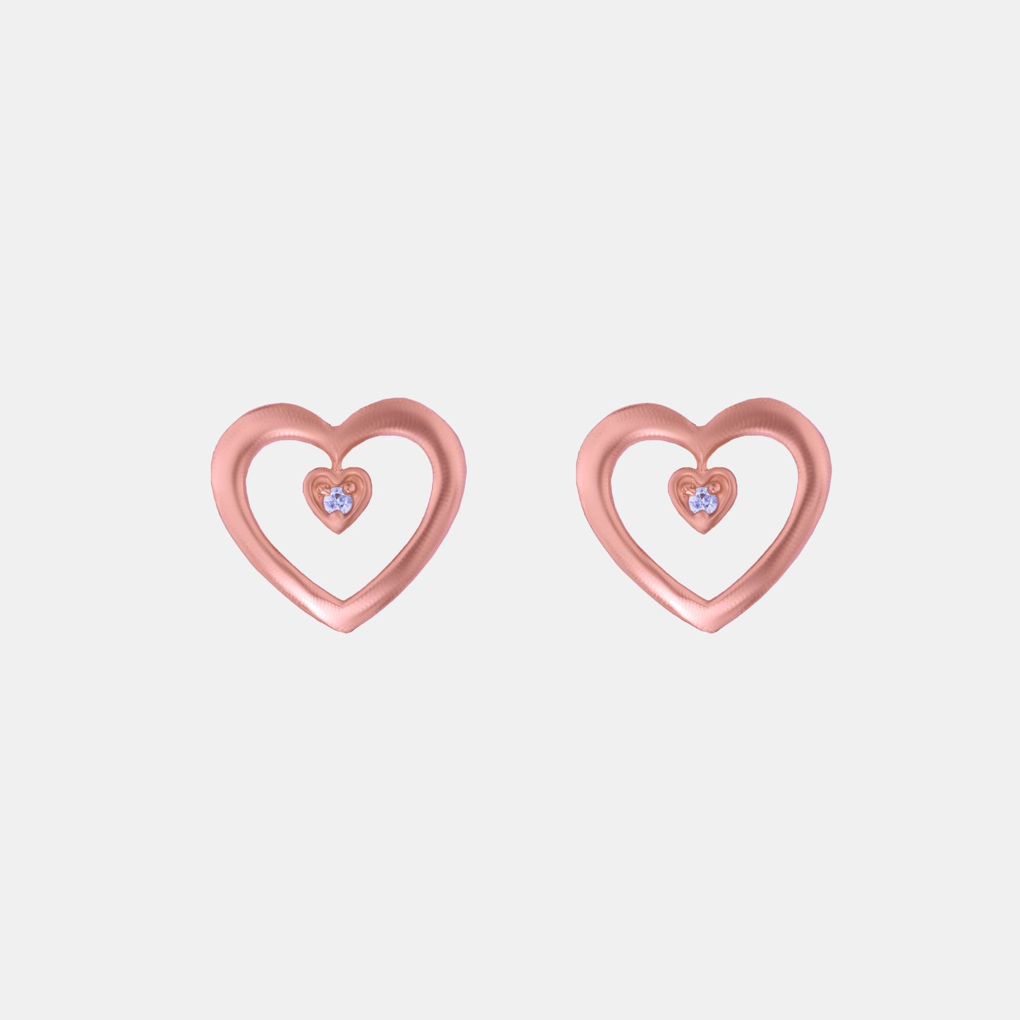 pair of rose gold heart earrings with diamond