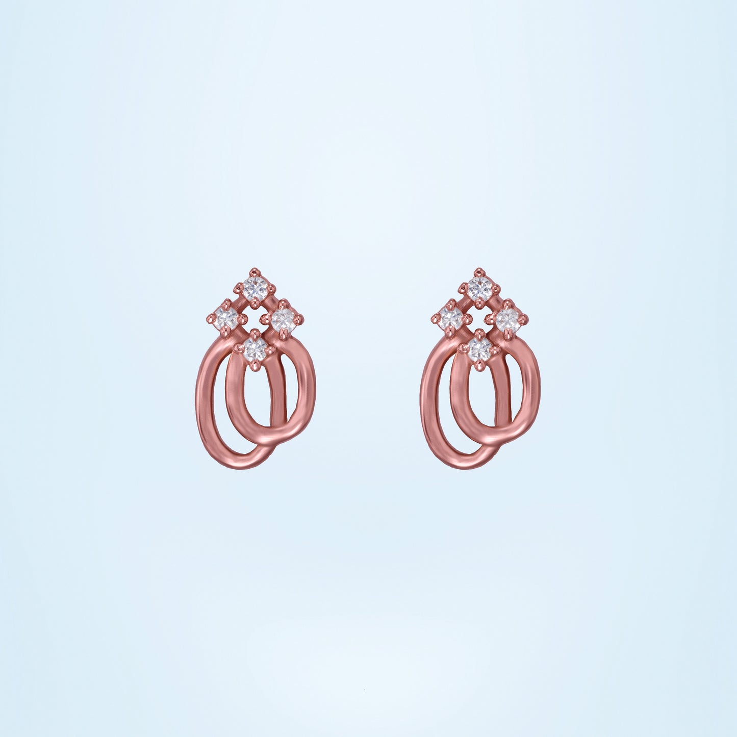 pair of rose gold earrings with a diamond