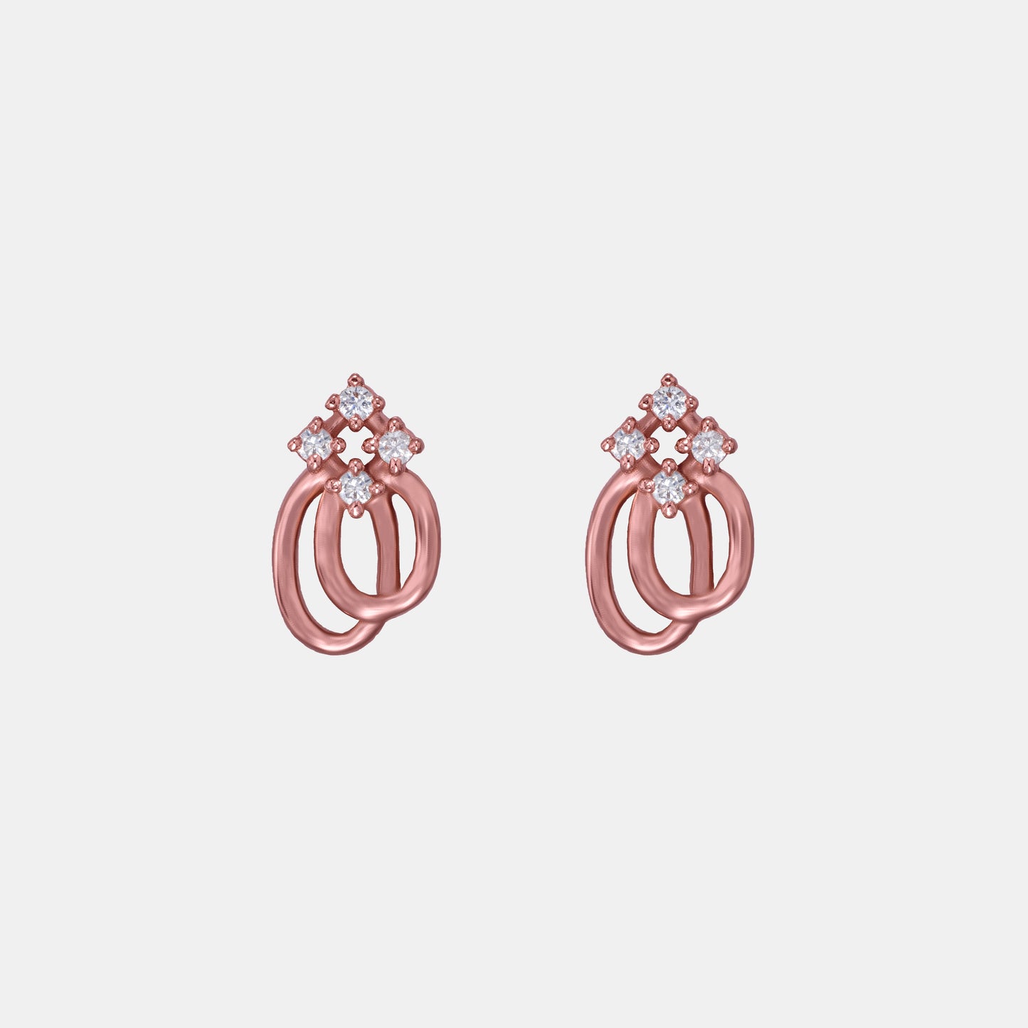 pair of rose gold earrings with a diamond