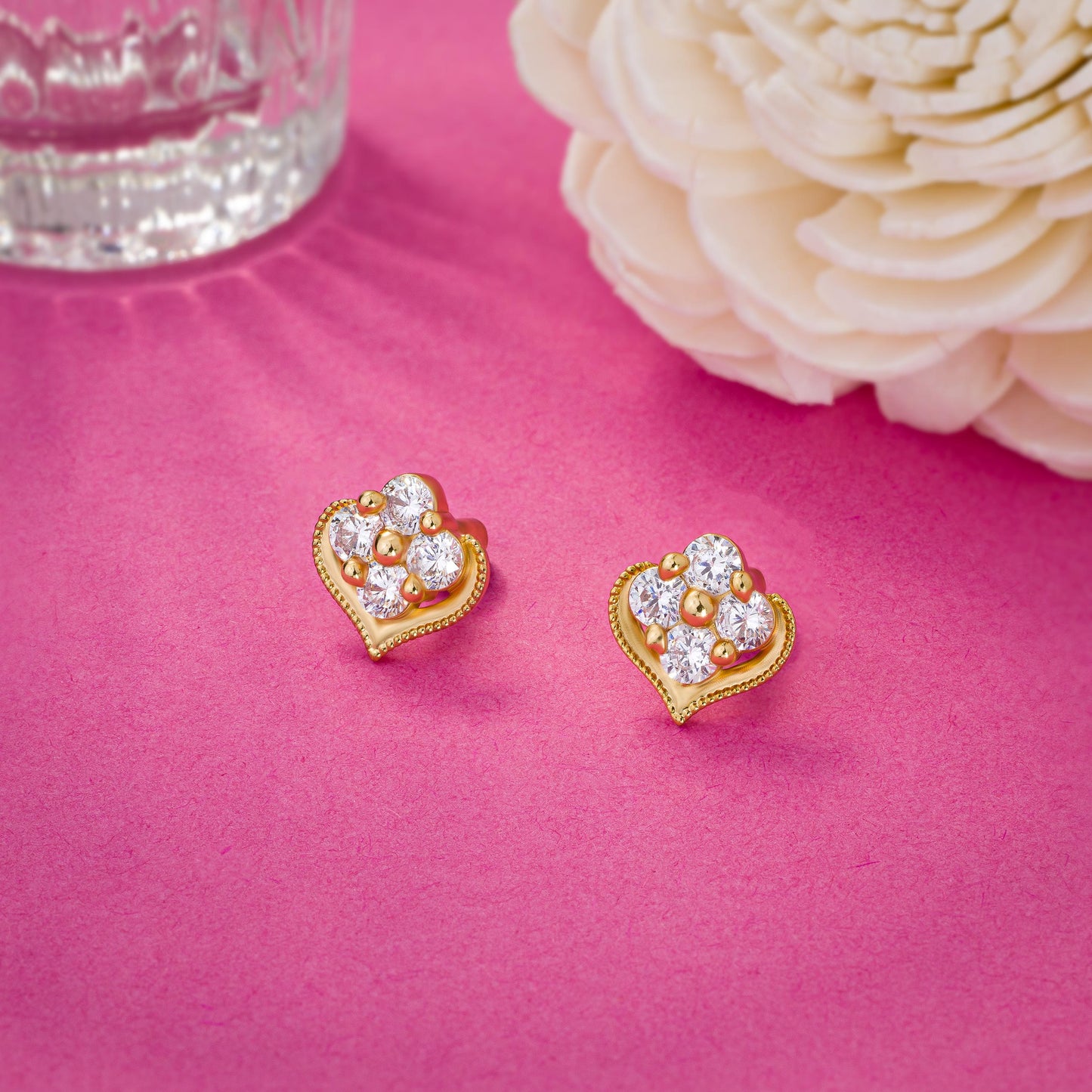 pair of golden earrings with diamonds